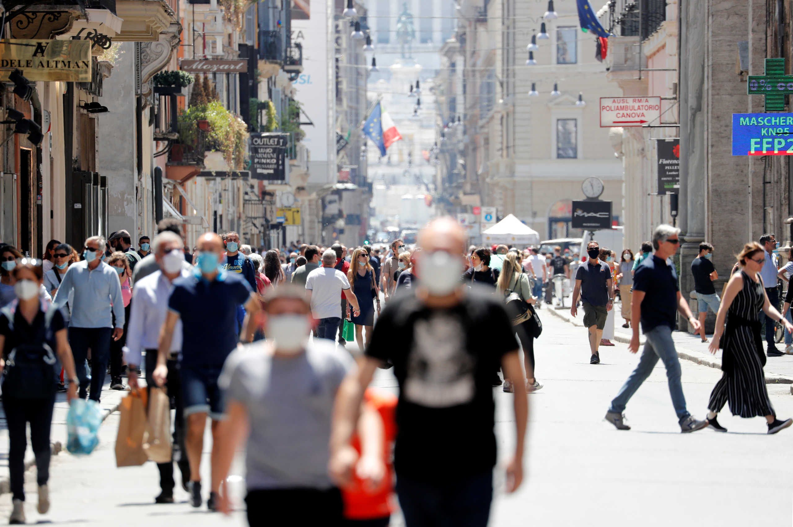 People walk in the Via del Corso, amid the coronavirus disease (COVID-19) outbreak, in Rome, Italy, May 23, 2020. REUTERS