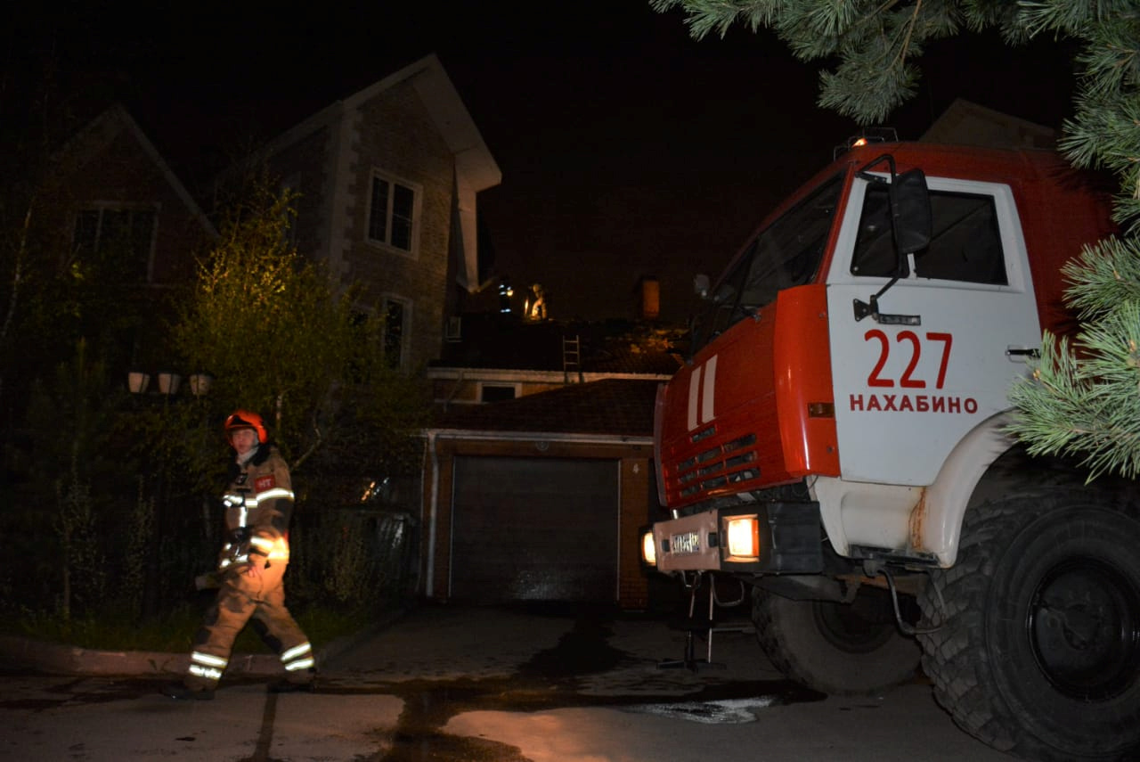 A firefighter walks past a private hospice after a fire killed nine elderly people in Krasnogorsk outside Moscow, Russia May 11, 2020.  Russian Emergency Situations Ministry