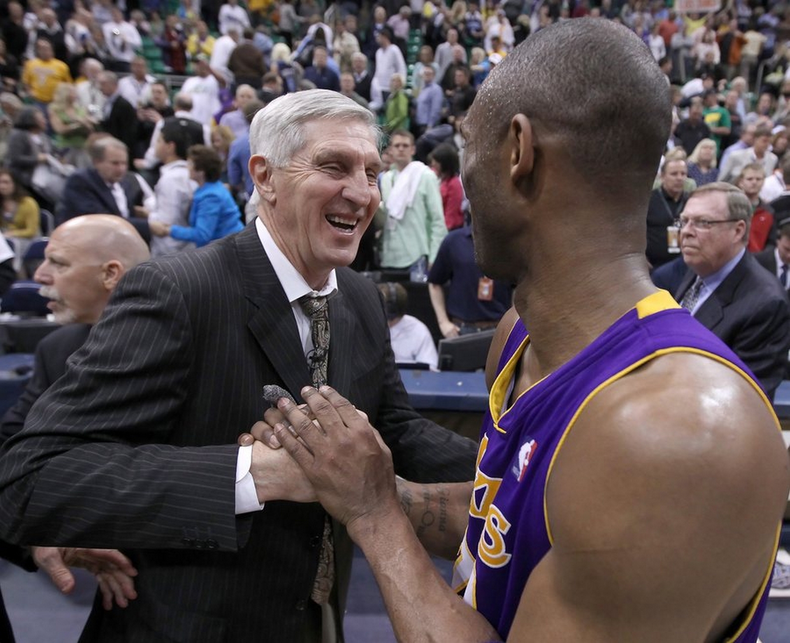 epa02151905 Los Angeles Lakers' Kobe Bryant (R) is congratulated by Utah Jazz' head coach Jerry Sloan (L) after game four of their NBA Western Conference second round playoff basketball game at the Energy Solutions Arena in Salt Lake City, Utah, USA, 10 May 2010. The Lakers beat the Jazz 111-96 to sweep and win the series 4-0.  EPA