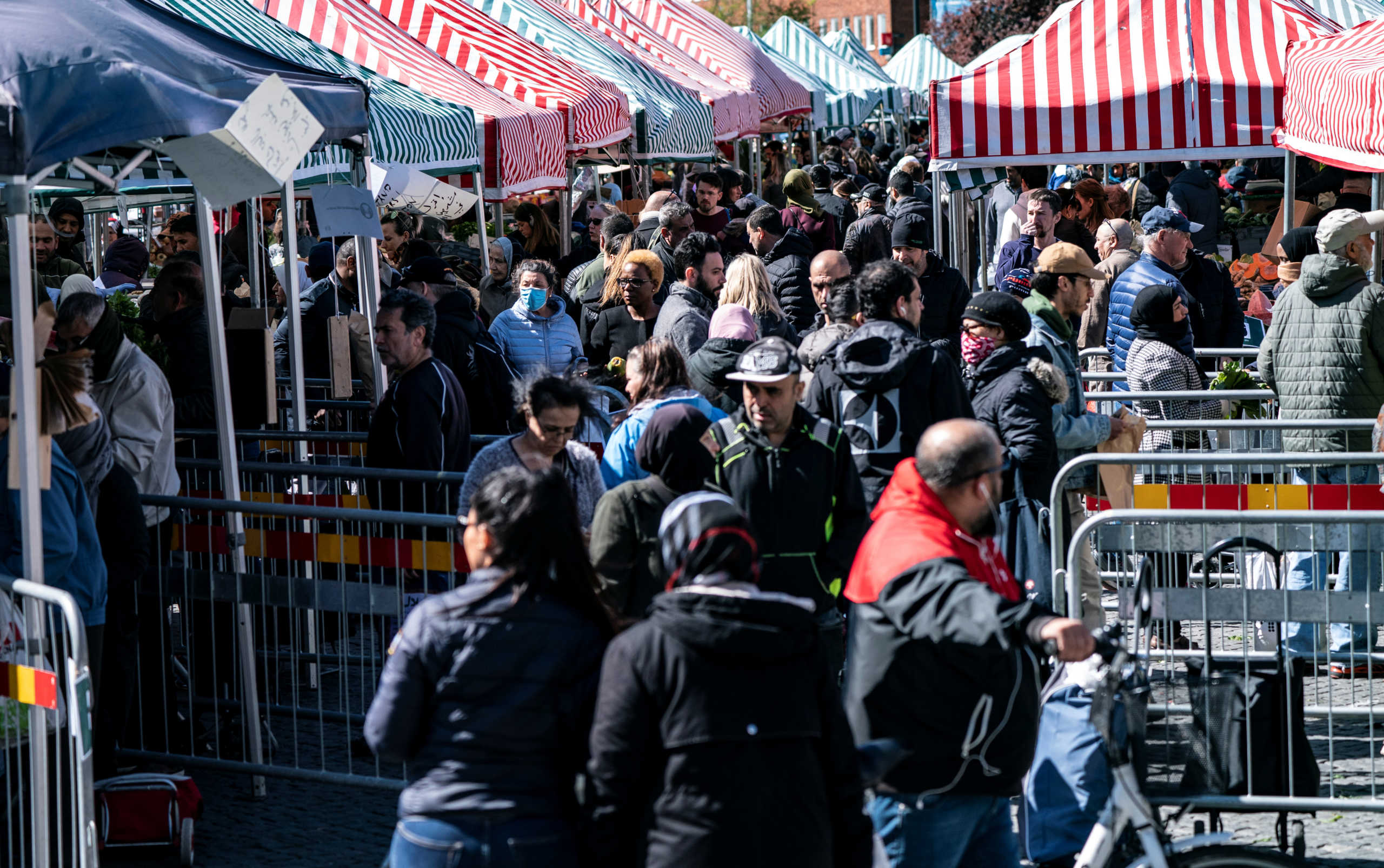 People buy vegetables as the fences and information signs are placed to reduce congestion due to the coronavirus disease (COVID-19) in Mollevangstorget, in Malmo, Sweden April 25, 2020   TT News Agency
