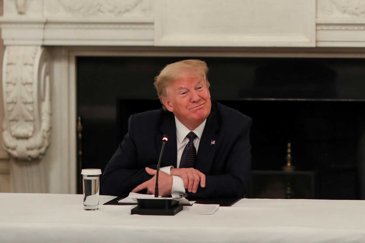 U.S. President Donald Trump speaks with restaurant executives and industry leaders during a coronavirus disease (COVID-19) pandemic meeting in the State Dining Room at the White House in Washington, U.S., May 18, 2020. REUTERS