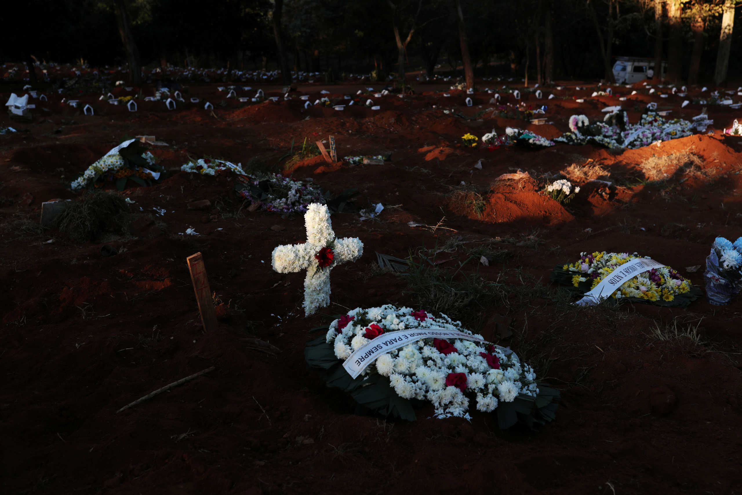 A cross is seen on a grave at Vila Formosa cemetery, Brazil's biggest cemetery, amid the outbreak of the coronavirus disease (COVID-19) in Sao Paulo, Brazil, May 26, 2020. REUTERS