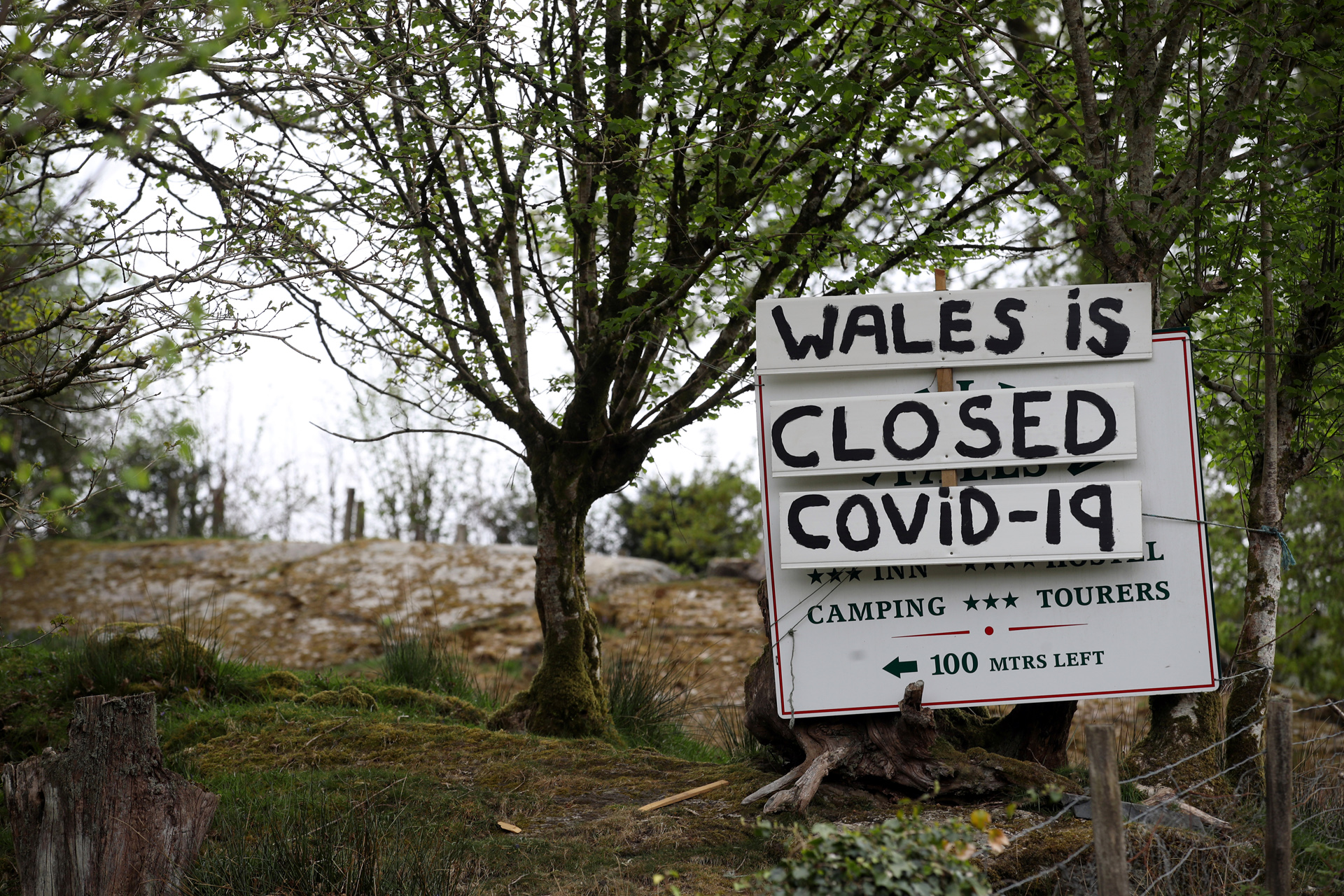 A sign is seen in Betws-y-Coed, as the spread of the coronavirus disease (COVID-19) continues, in Wales, Britain, April 25, 2020. REUTERS