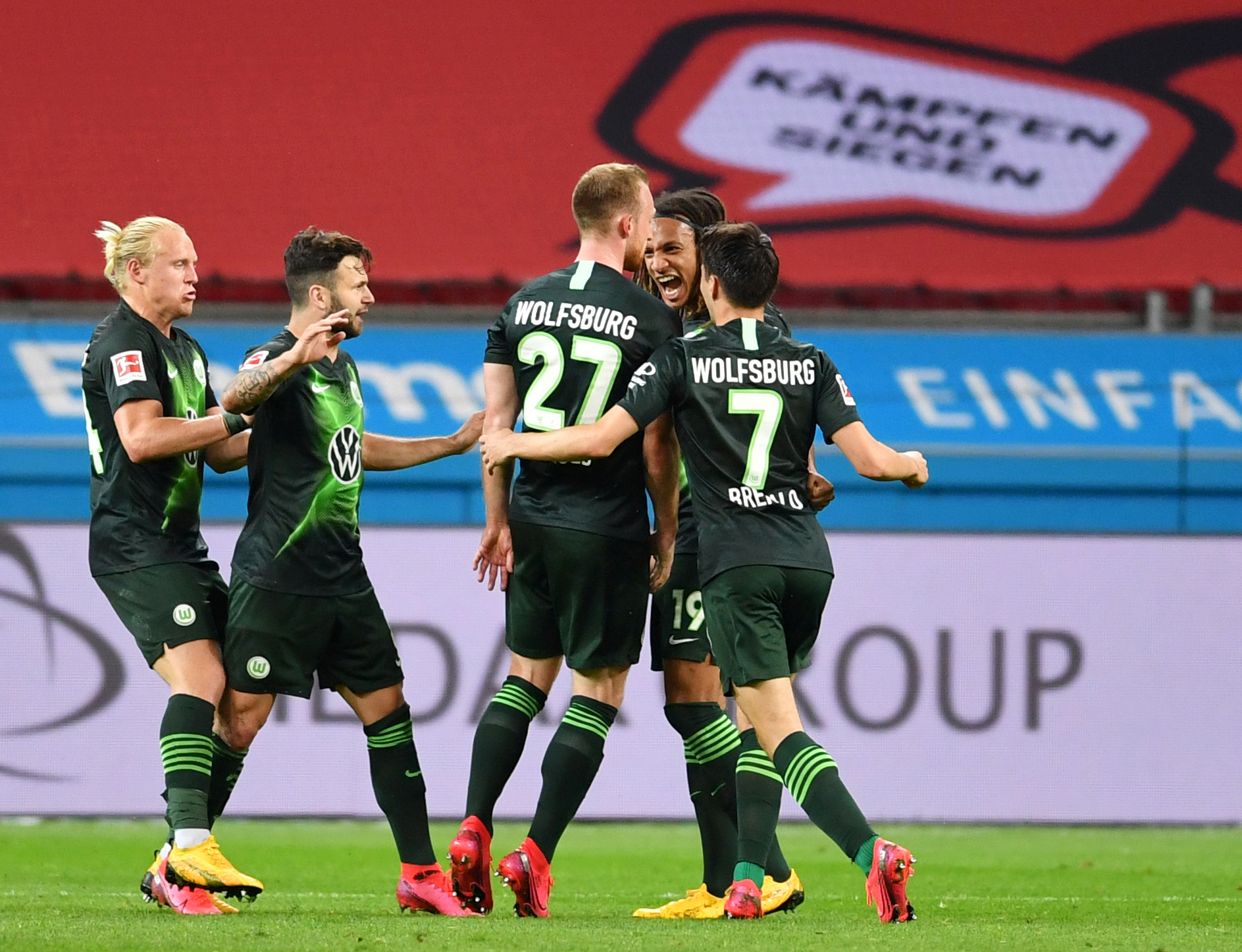 Soccer Football - Bundesliga - Bayer Leverkusen v VfL Wolfsburg - BayArena, Leverkusen, Germany - May 26, 2020 VfL Wolfsburg's Maximilian Arnold celebrates scoring their second goal with teammates, as play resumes behind closed doors following the outbreak of the coronavirus disease (COVID-19) Marius Becker
