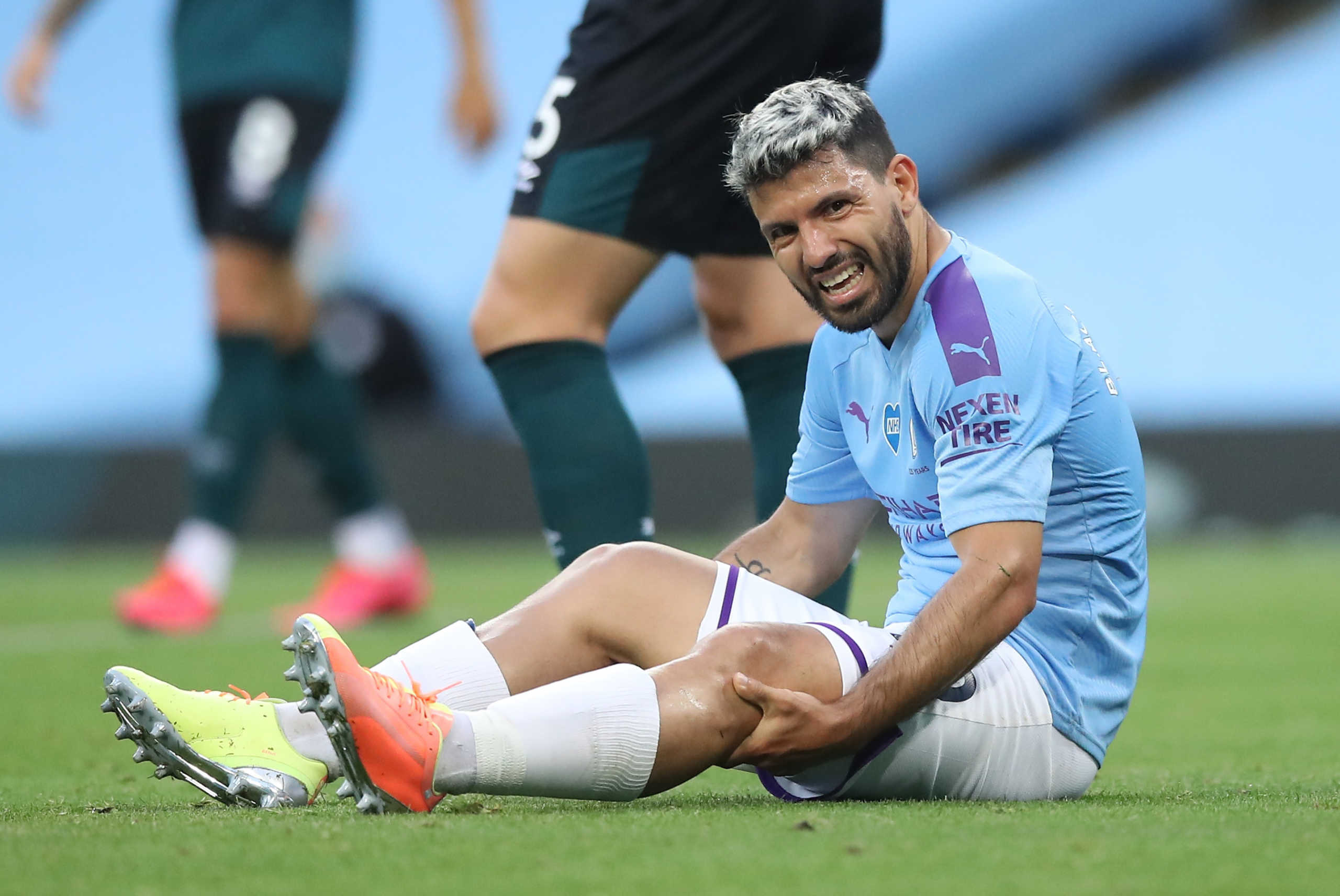 Soccer Football - Premier League - Manchester City v Burnley - Etihad Stadium, Manchester, Britain - June 22, 2020 Manchester City's Sergio Aguero reacts after sustaining an injury, as play resumes behind closed doors following the outbreak of the coronavirus disease (COVID-19) Martin Rickett