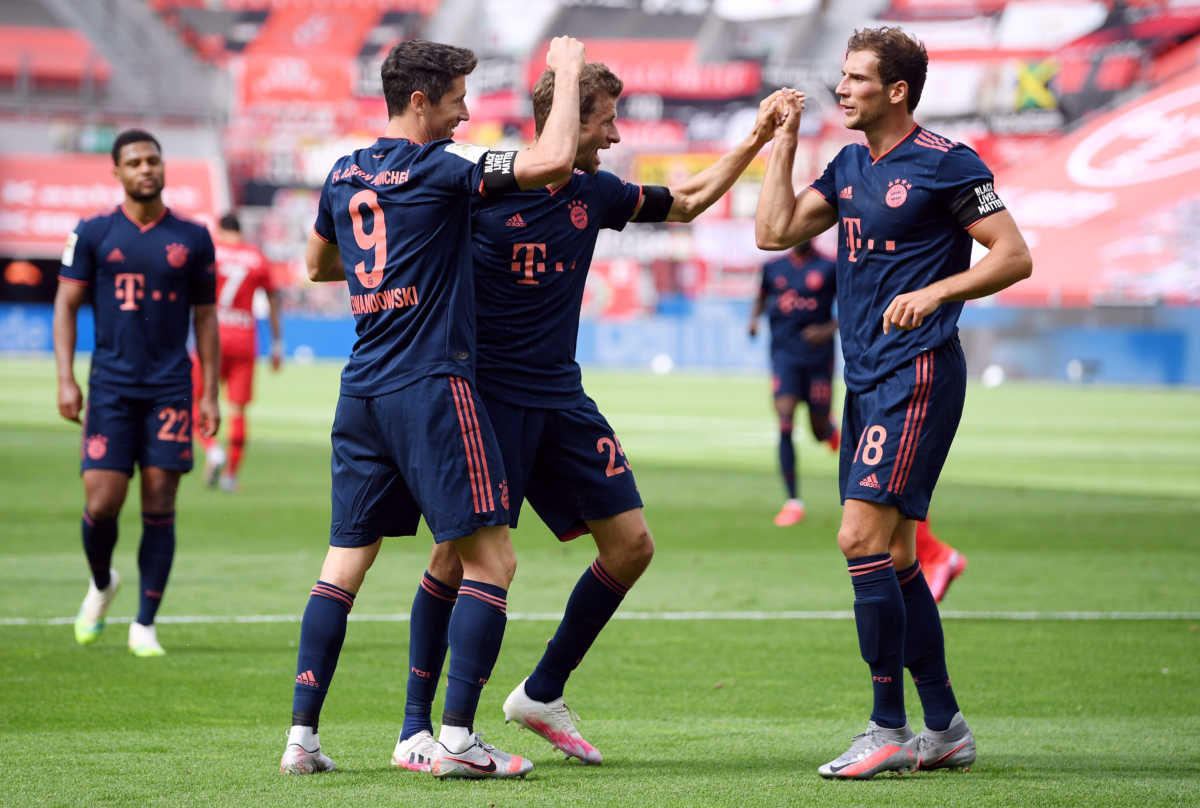 Soccer Football - Bundesliga - Bayer Leverkusen v Bayern Munich- BayArena, Leverkusen, Germany - June 6, 2020 Bayern Munich's Robert Lewandowski celebrates scoring their fourth goal with teammates, as play resumes behind closed doors following the outbreak of the coronavirus disease (COVID-19) Matthias Hangst