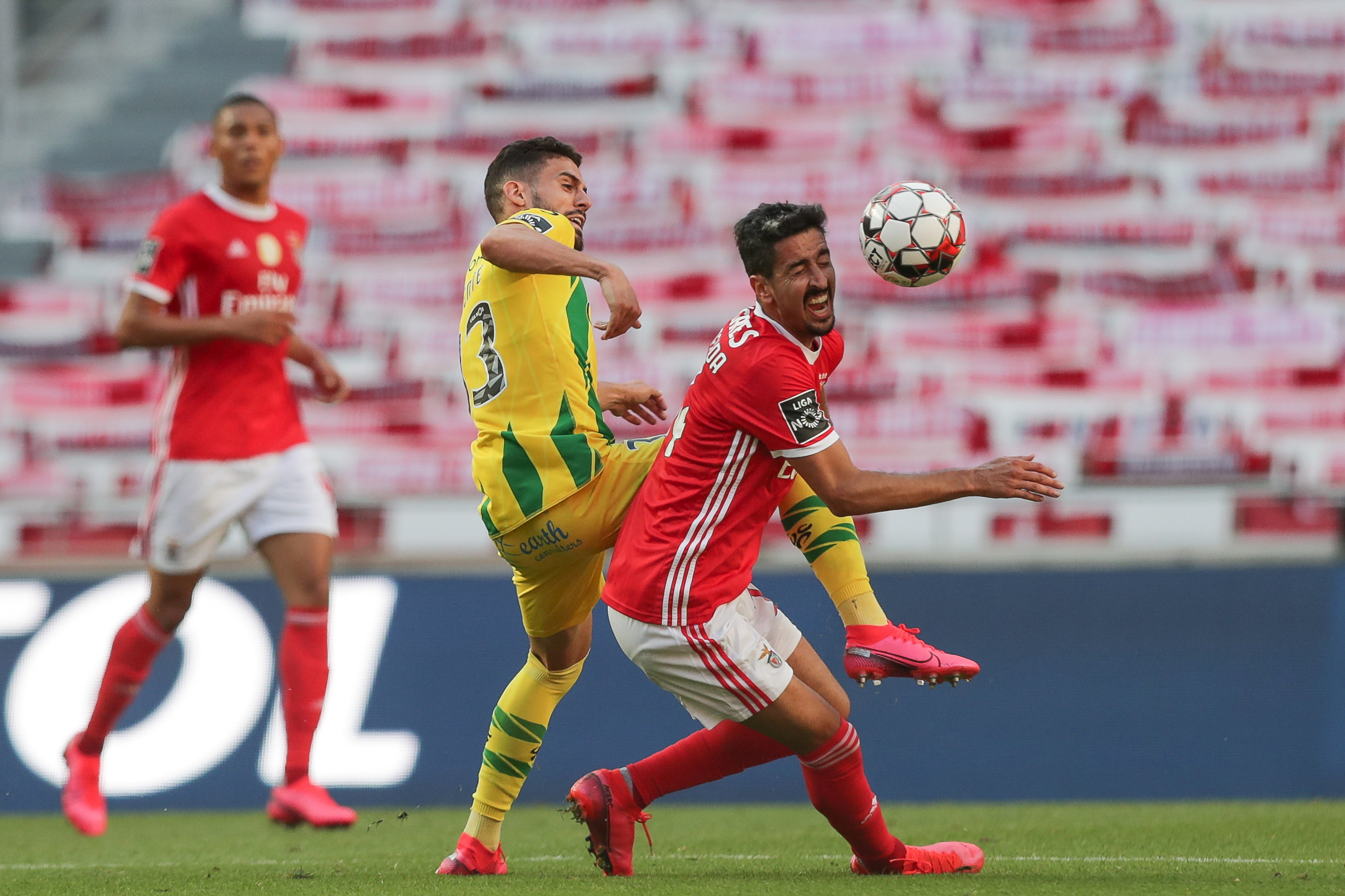 Soccer Football - Primeira Liga - Benfica v Tondela - Estadio da Luz, Lisbon, Portugal - June 4, 2020. Benfica's Andre Almeida in action with Tondela's Yohan Tavares, as play resumes behind closed doors following the outbreak of the coronavirus disease (COVID-19) Tiago Petinga