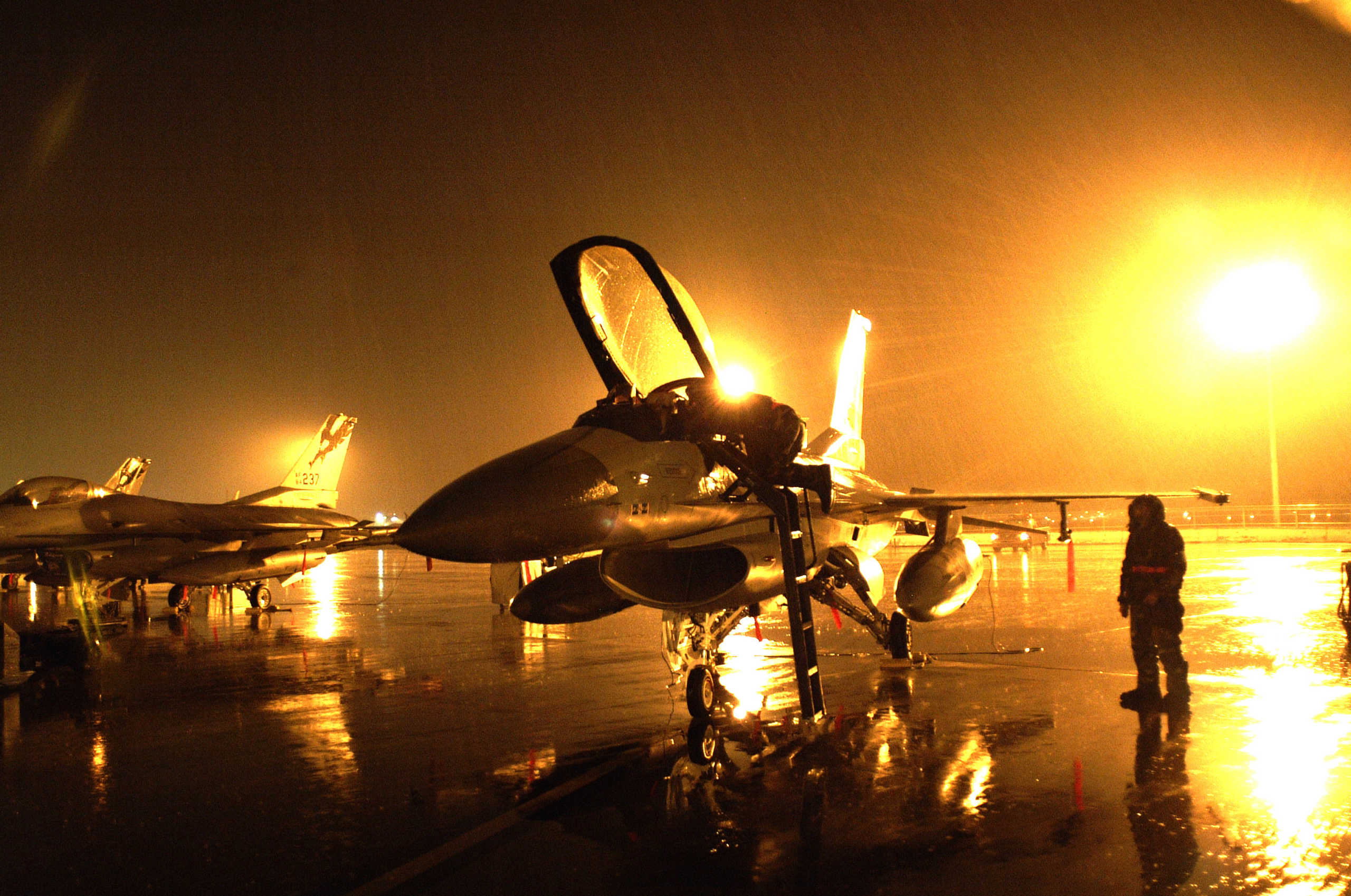 050215-F-0106L-211
An Air National Guard F-16 Fighting Falcon is prepared for launch during a rain storm at the Fresno Air National Guard Base, Fresno, Calif., on Feb. 15, 2005.  The F-16 and its pilot are assigned to the 194th Fighter Wing and are participating in Operation Coronet White, an operational readiness inspection.  DoD photo by Staff Sgt. David J. Loeffler, U.S. Air Force.  (Released)
