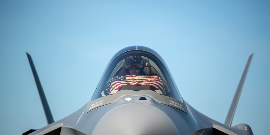 An F-35 pilot prepares for take off from the Vermont Air National Guard Base with the flag of the United States, before a flyover honoring Vermont’s front line coronavirus disease (COVID-19) responders and essential workers in South Burlington, Vermont, U.S. May 22, 2020. Picture taken May 22, 2020.  U.S. Air National Guard