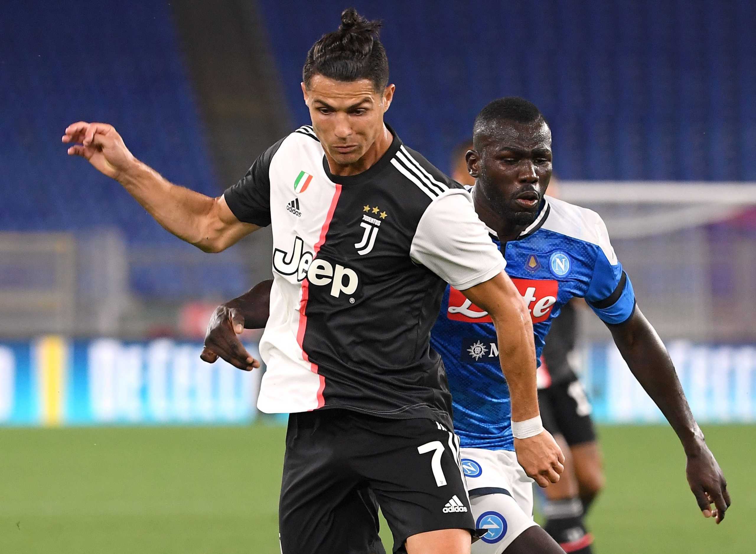 Soccer Football - Coppa Italia - Final - Napoli v Juventus - Stadio Olimpico, Rome, Italy - June 17, 2020 Juventus' Cristiano Ronaldo in action with Napoli's Kalidou Koulibaly, as play resumes behind closed doors following the outbreak of the coronavirus disease (COVID-19)  REUTERS