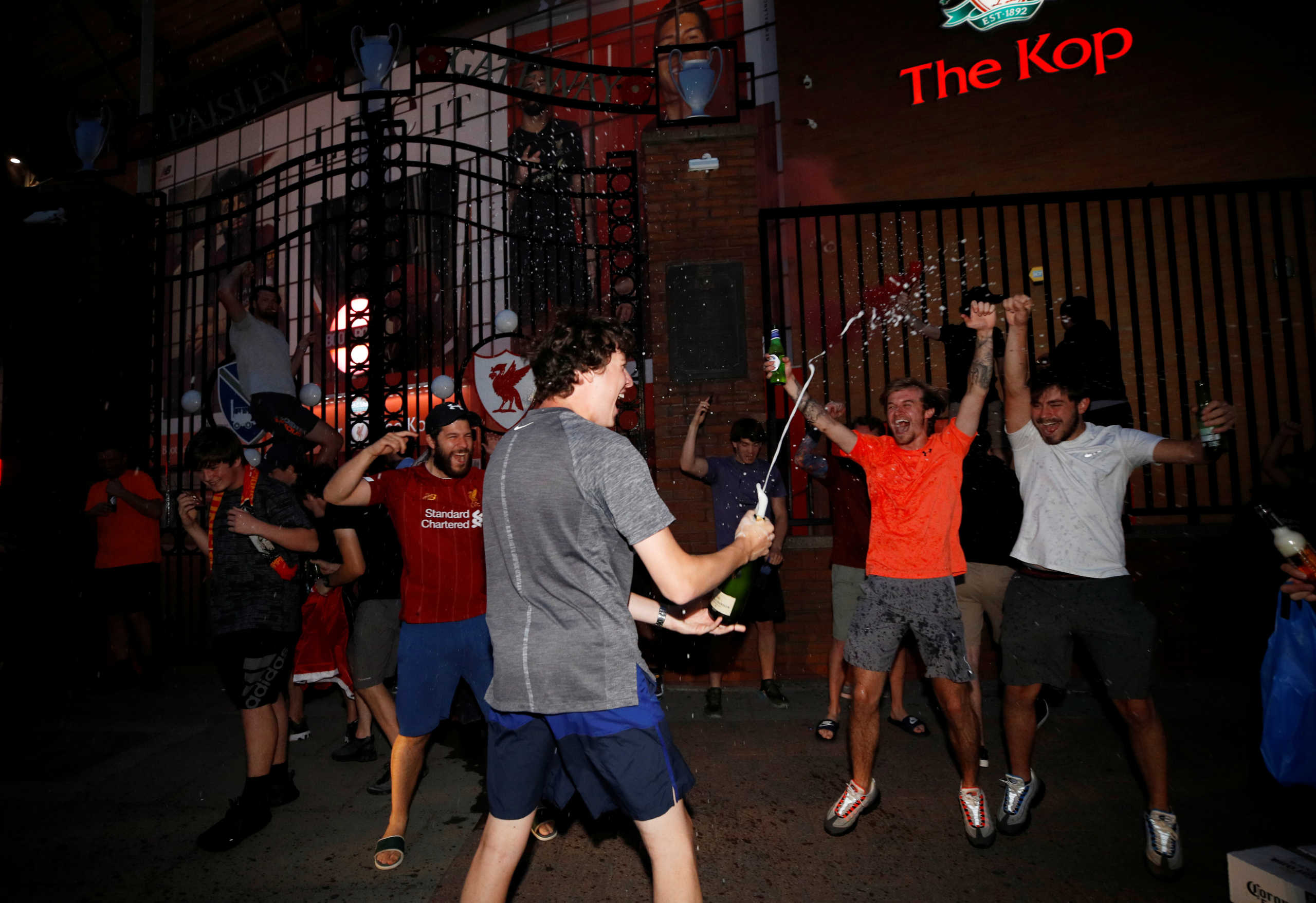 Soccer Football - Premier League - Liverpool fans celebrate winning the Premier League - Liverpool, Britain - June 25, 2020  Liverpool fans celebrate winning the Premier League outside Anfield after Chelsea won their match against Manchester City  REUTERS