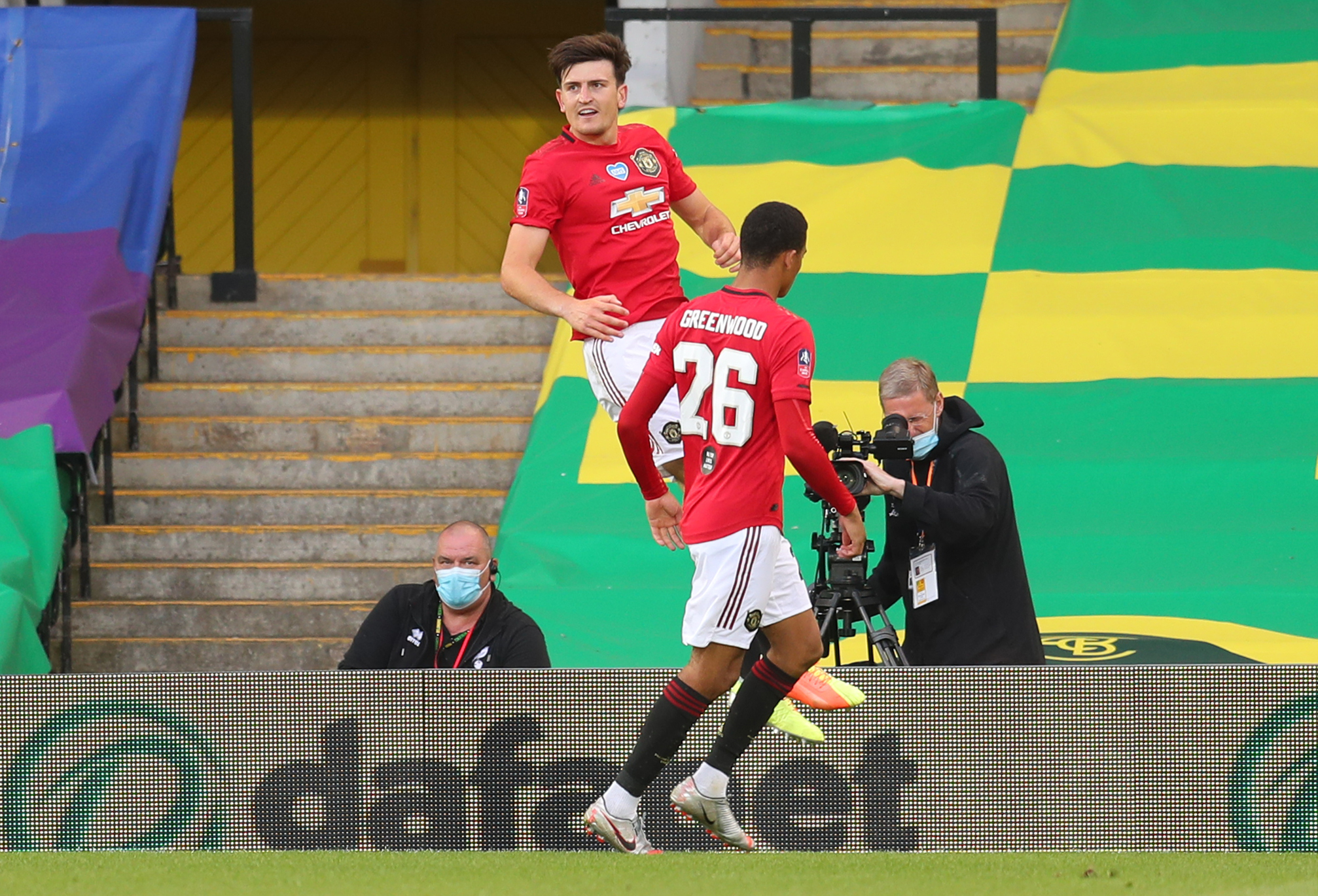 Soccer Football -  FA Cup - Quarter Final - Norwich City v Manchester United - Carrow Road, Norwich, Britain - June 27, 2020 Manchester United's Harry Maguire celebrates scoring their second goal with teammates, as play resumes behind closed doors following the outbreak of the coronavirus disease (COVID-19)  Catherine Ivill