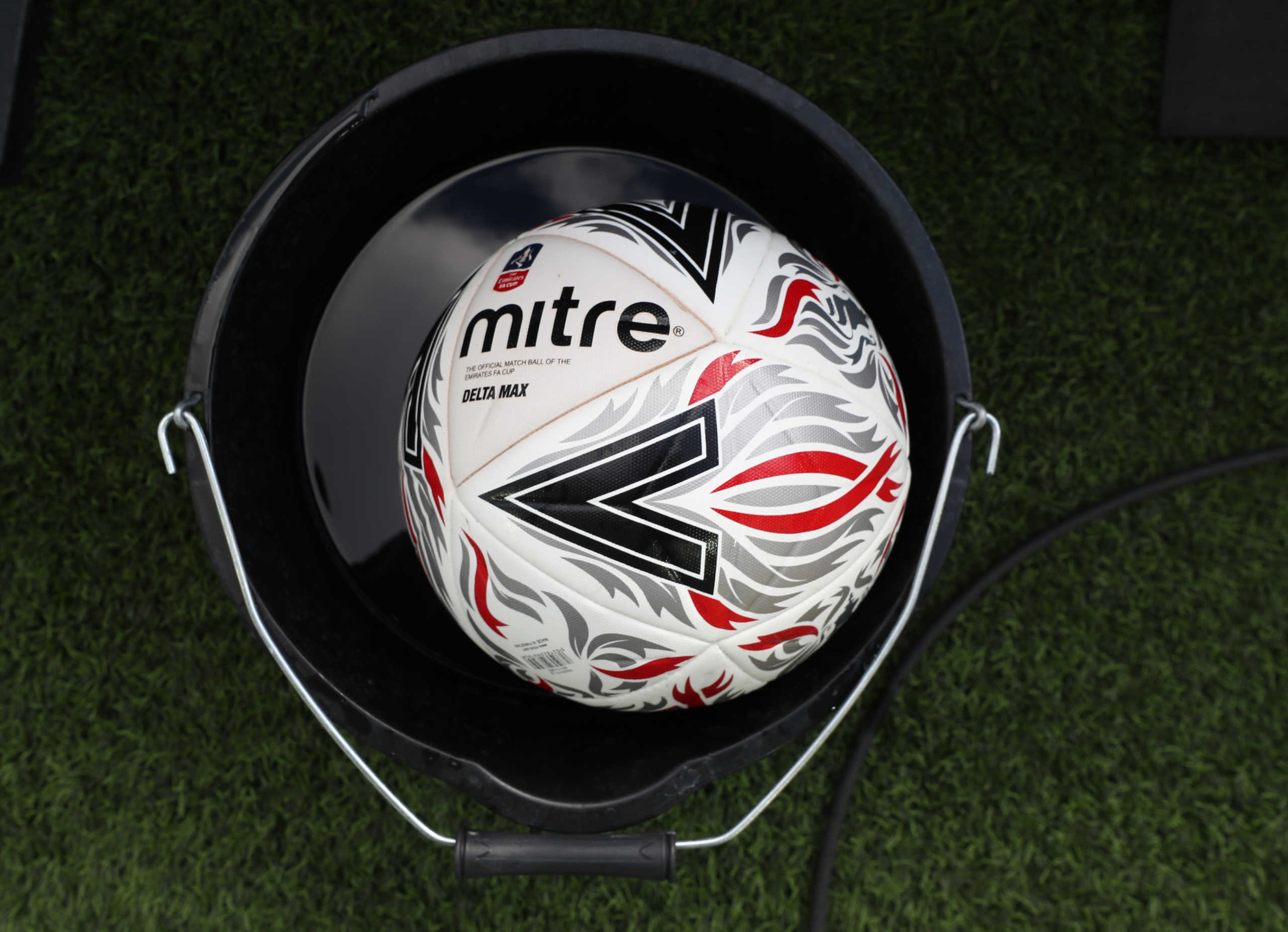 Soccer Football -  FA Cup - Quarter Final - Norwich City v Manchester United - Carrow Road, Norwich, Britain - June 27, 2020 General view of the match ball sitting in a bucket of disinfectant before the match, as play resumes behind closed doors following the outbreak of the coronavirus disease (COVID-19)  Catherine Ivill