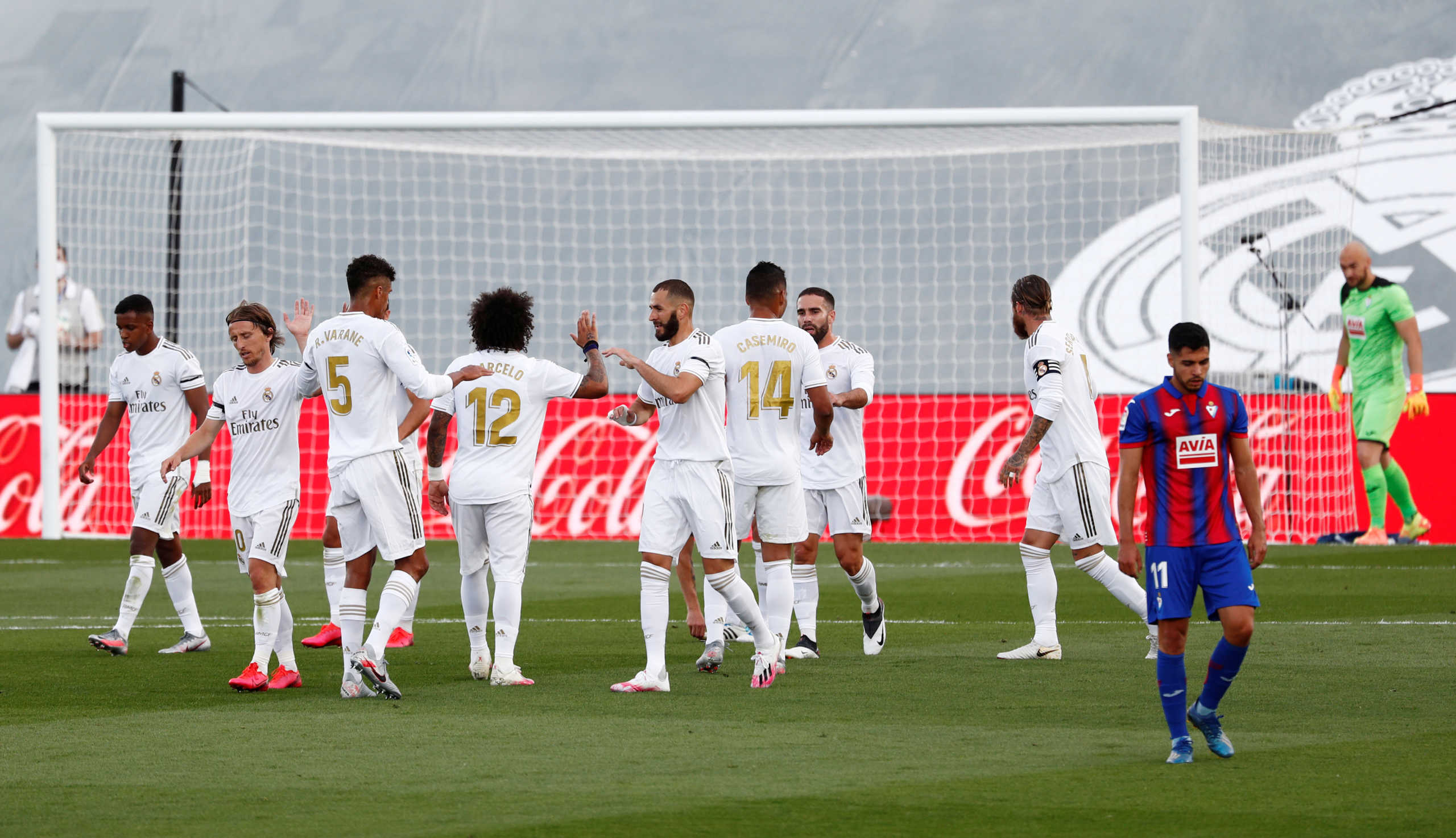 Soccer Football - La Liga Santander - Real Madrid v Eibar - Alfredo Di Stefano Stadium, Madrid, Spain - June 14, 2020   Real Madrid's Sergio Ramos celebrates scoring their second goal with teammates, as play resumes behind closed doors following the outbreak of the coronavirus disease (COVID-19)   REUTERS