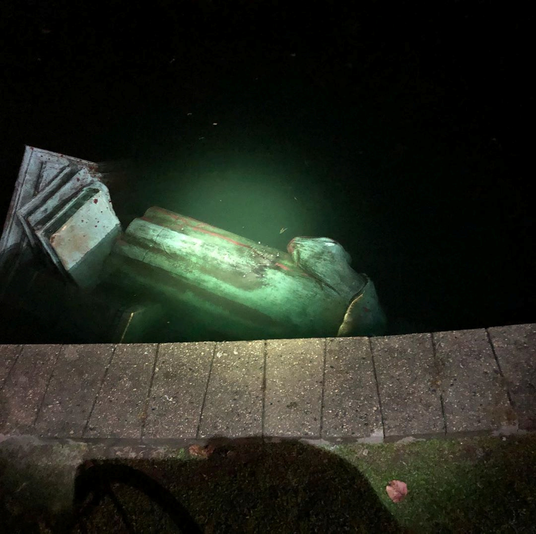 The statue of Christopher Columbus is seen in a lake after it was pulled down by protesters, following the death of George Floyd who died in police custody in Minneapolis, in Richmond, Virginia, U.S., June 9, 2020, in this picture obtained from social media. Picture taken June 9, 2020. Instagram