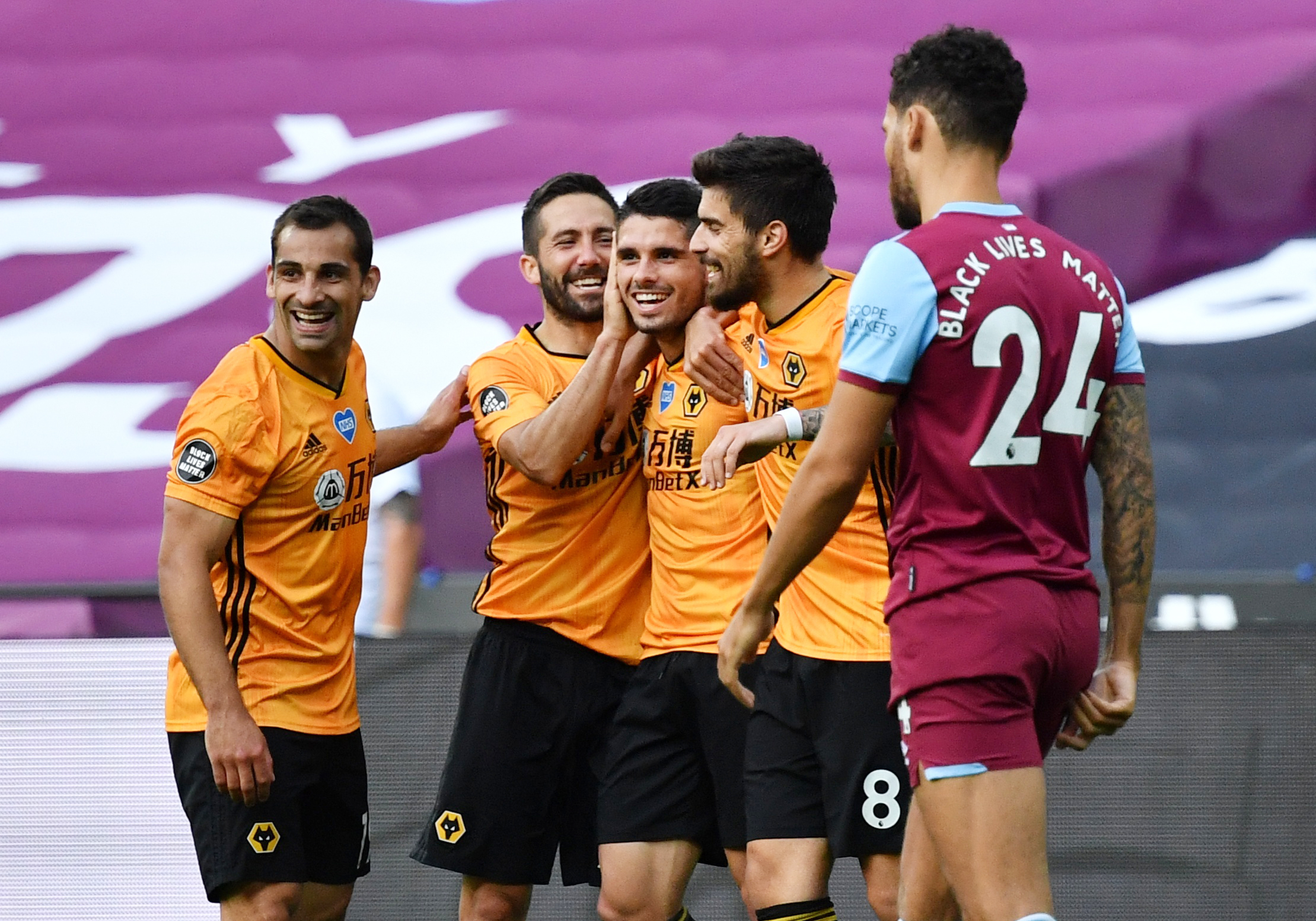 Soccer Football - Premier League - West Ham United v Wolverhampton Wanderers - London Stadium, London, Britain - June 20, 2020  Wolverhampton Wanderers' Pedro Neto celebrates scoring their second goal with Jonny, Ruben Neves and Joao Moutinho as play resumes behind closed doors following the outbreak of the coronavirus disease (COVID-19) Ben Stansall