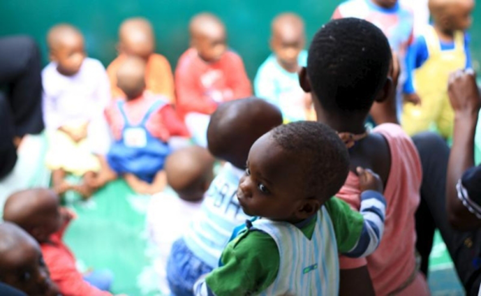 Abandoned children are seen during a group singing session at a home in Uganda's capital Kampala May 14, 2015. Ugandan families have been bribed, tricked or coerced into giving up their children to U.S. citizens and other foreigners for adoption, a Thomson Reuters Foundation investigation has found. Picture taken May 14, 2015. REUTERS