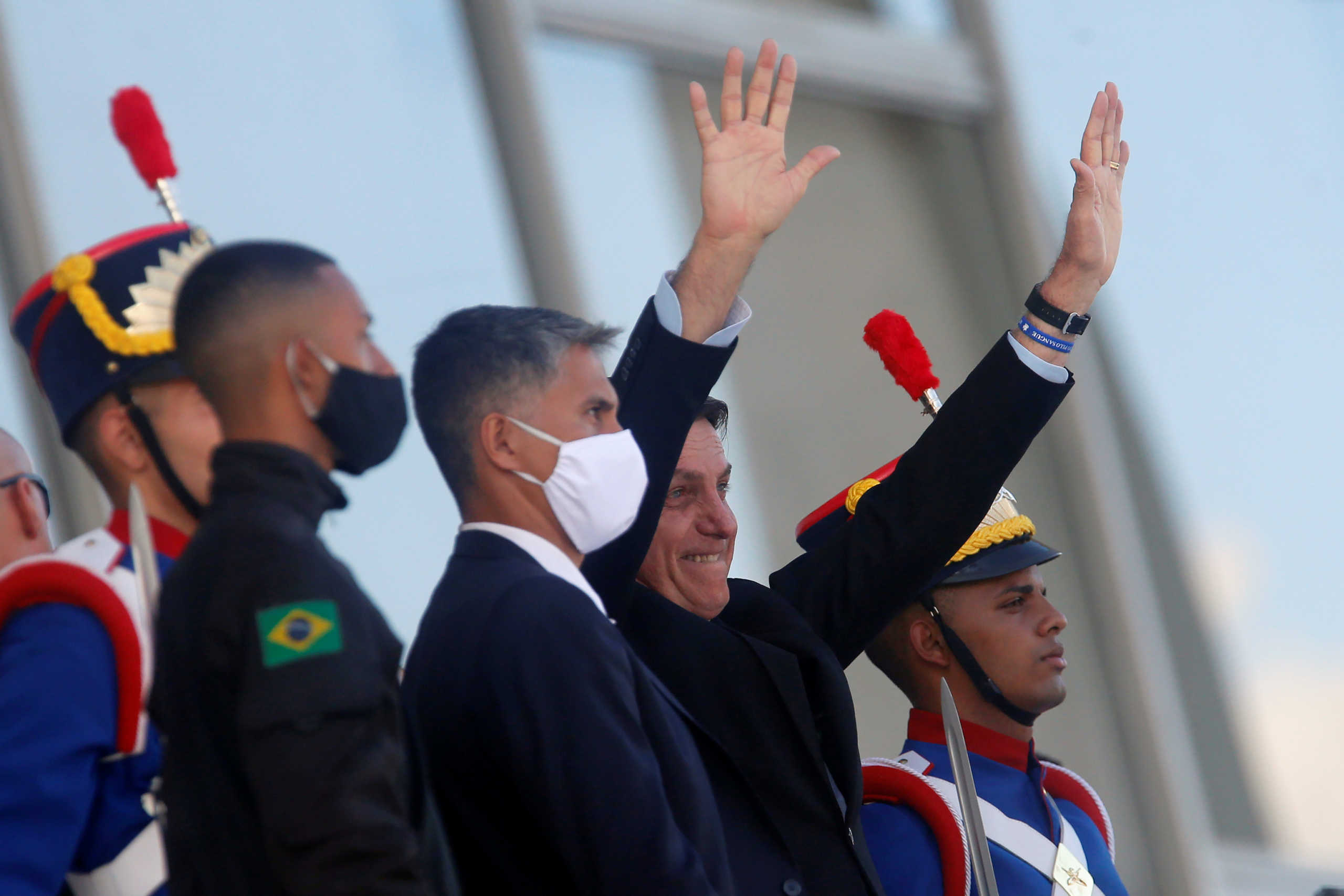 Brazil's President Jair Bolsonaro greets his supporters at the ramp of  the Planalto Palace, amid the spread of the coronavirus disease (COVID-19), in Brasilia, Brazil June 5, 2020. REUTERS