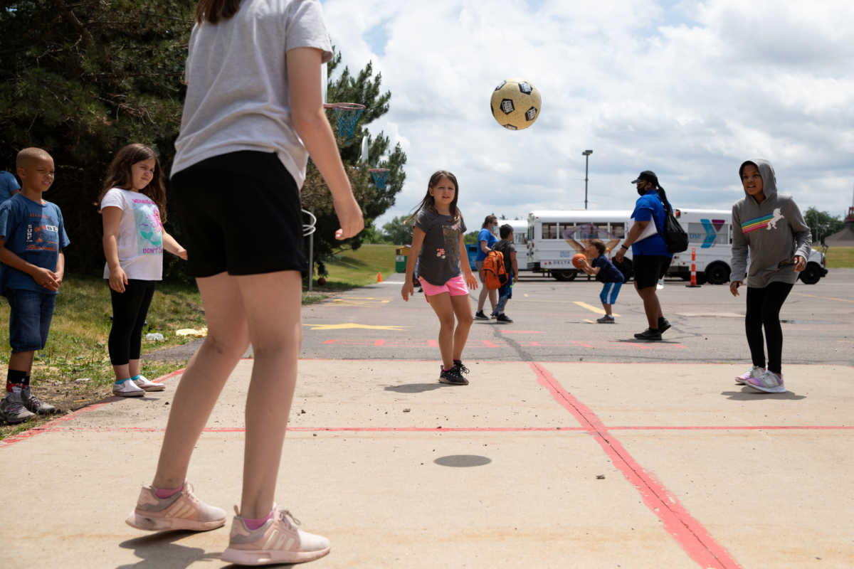 Children play outside at Farmington Family YMCA summer camp, amid the coronavirus disease (COVID-19) outbreak, in Farmington Hills, Michigan, U.S., June 23, 2020.  REUTERS
