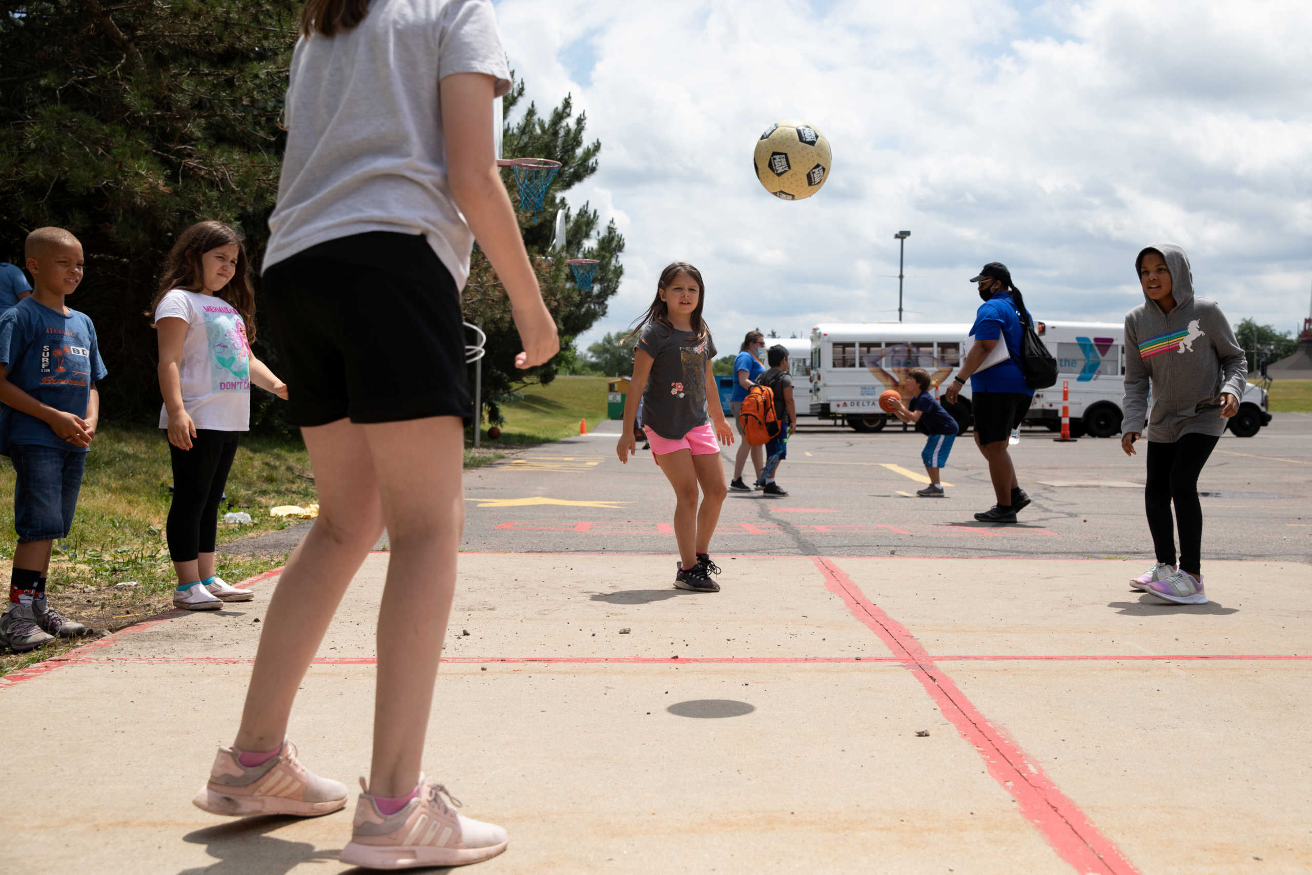 Children play outside at Farmington Family YMCA summer camp, amid the coronavirus disease (COVID-19) outbreak, in Farmington Hills, Michigan, U.S., June 23, 2020.  REUTERS