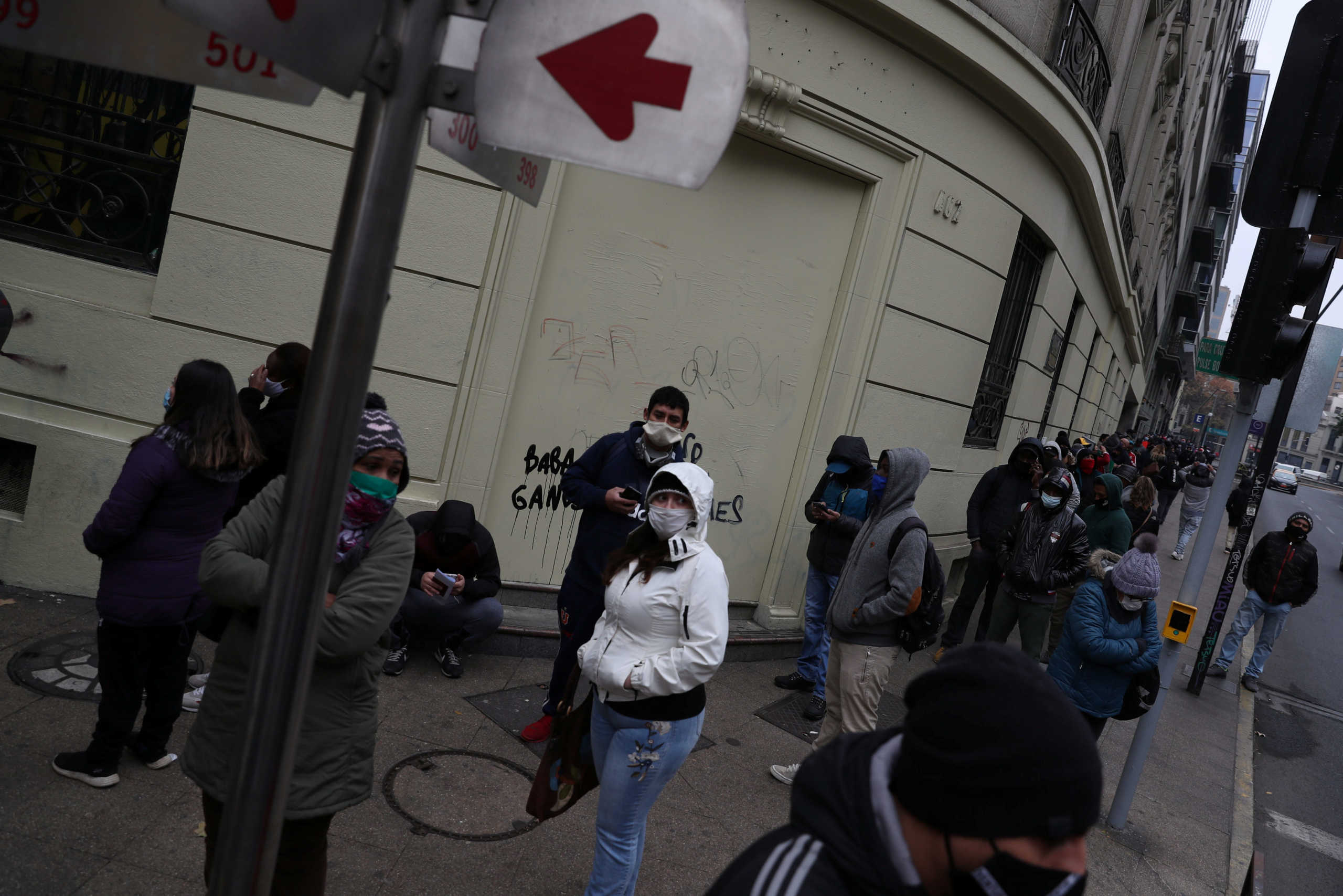 Unemployed people queue to apply for unemployment insurance outside of the office of an unemployment fund administrator, amid the spread of the coronavirus disease (COVID-19) in Santiago, Chile June 8, 2020. REUTERS