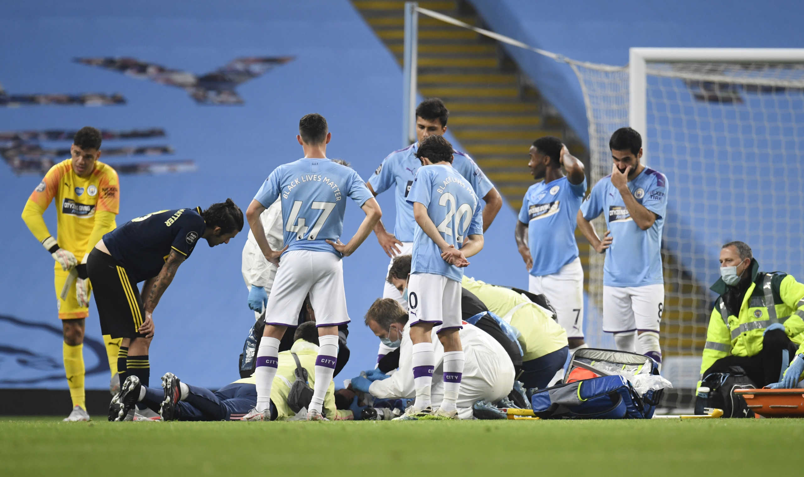 Soccer Football - Premier League - Manchester City v Arsenal - Etihad Stadium, Manchester, Britain - June 17, 2020  Manchester City's Eric Garcia receives medical attention after sustaining an injury as play resumes behind closed doors following the outbreak of the coronavirus disease (COVID-19) Peter Powell