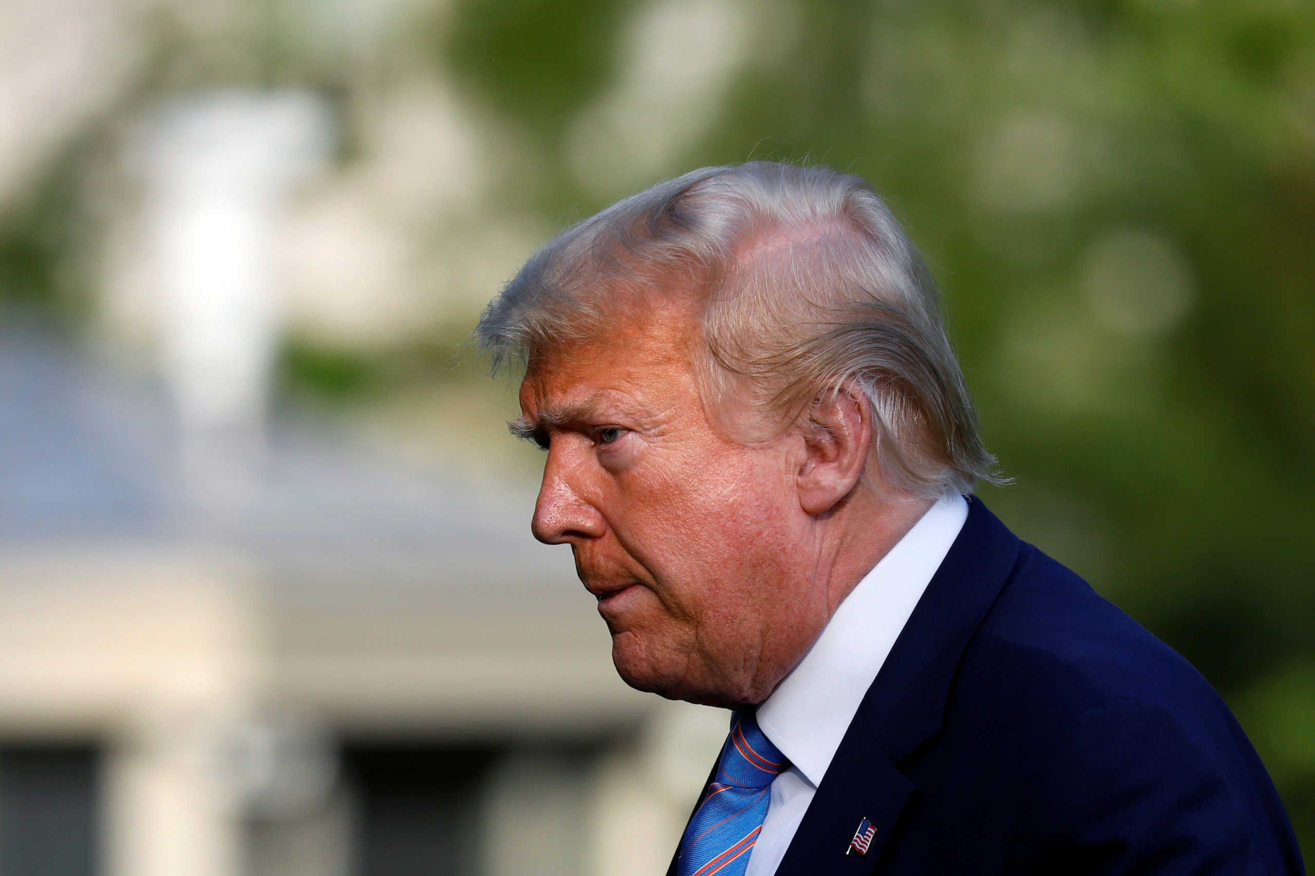 U.S. President Donald Trump walks on the South Lawn of the White House upon his return to Washington, U.S., after a weekend in Bedminster, New Jersey, June 14, 2020. REUTERS