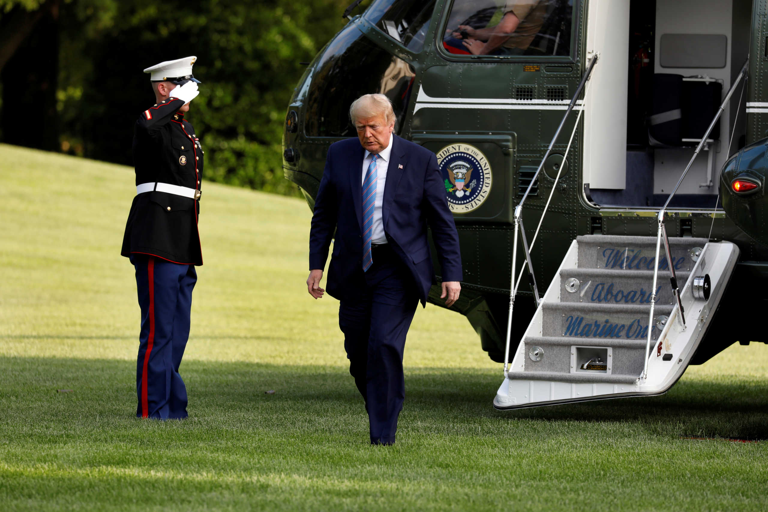 U.S. President Donald Trump walks on the South Lawn of the White House upon his return to Washington, U.S., after a weekend in Bedminster, New Jersey, June 14, 2020. REUTERS