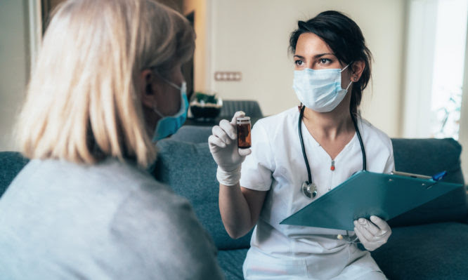 Female doctor consults mature patient during the quarantine for coronavirus