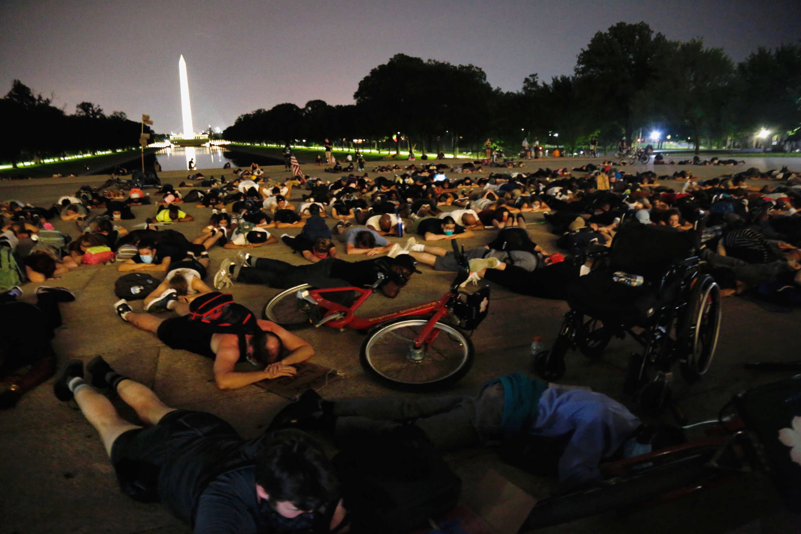 Demonstrators lie down during a protest against racial inequality in the aftermath of the death in Minneapolis police custody of George Floyd at the Lincoln Memorial in Washington, U.S., June 6, 2020. REUTERS