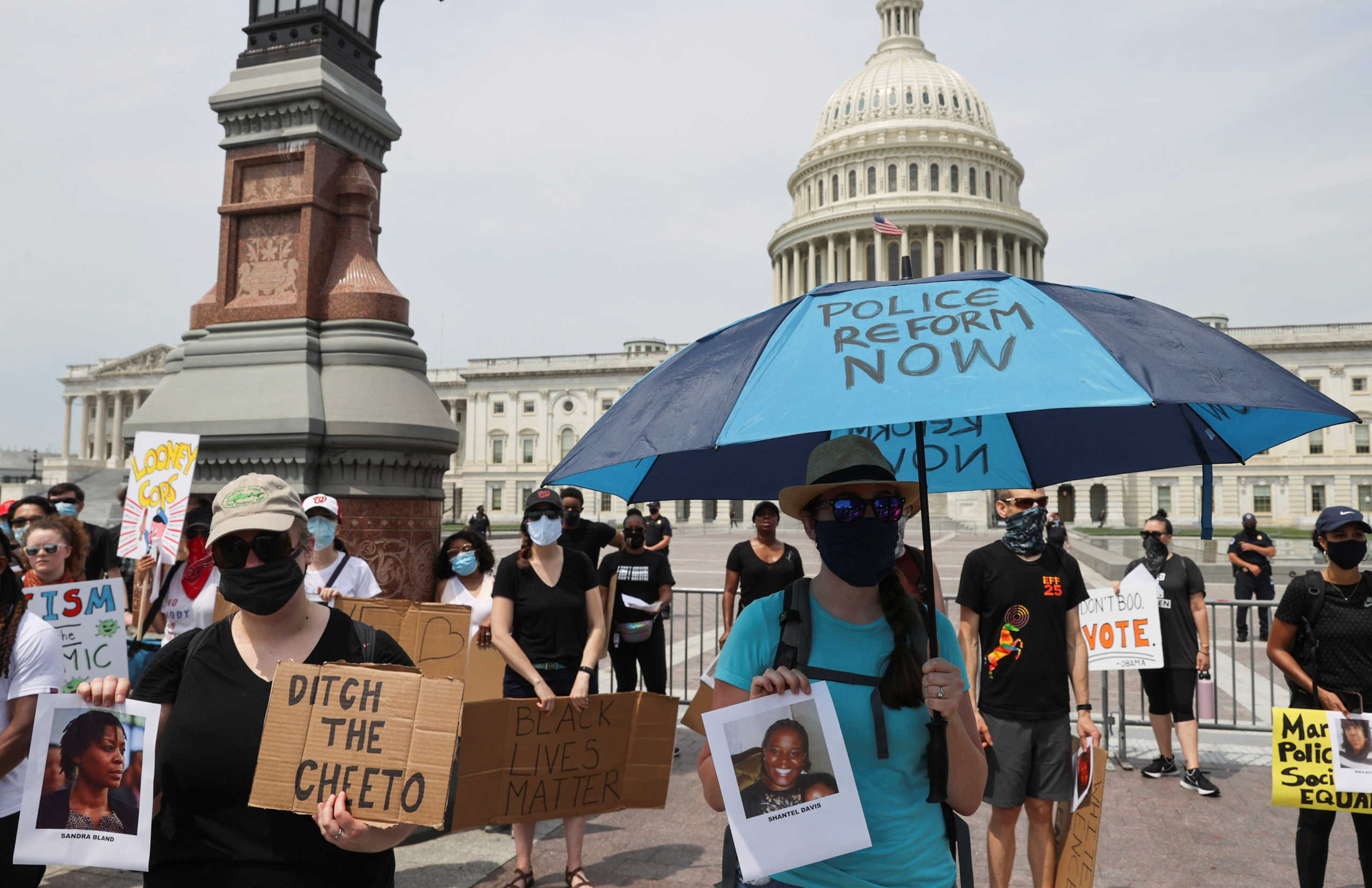 Demonstrators hold signs and pictures in front of the U.S. Capitol Building during a protest against racial inequality in the aftermath of the death in Minneapolis police custody of George Floyd, in Washington, U.S. June 6, 2020. REUTERS