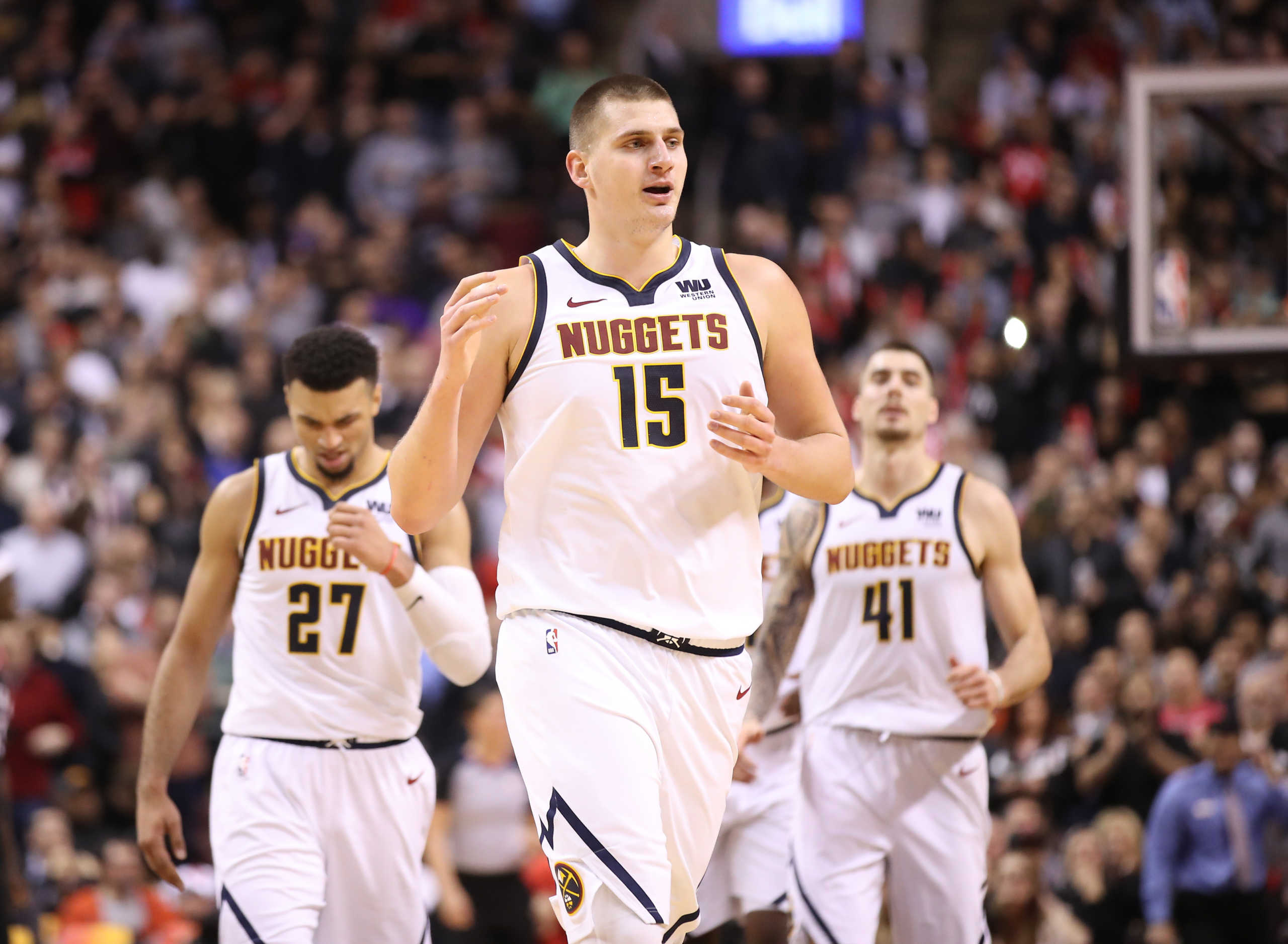 Dec 3, 2018; Toronto, Ontario, CAN; Denver Nuggets center Nikola Jokic (15) celebrates after scoring a basket late in the fourth quarter against the Toronto Raptors at Scotiabank Arena. The Nuggets beat the Raptors 106-103. Mandatory Credit: Tom Szczerbowski-USA TODAY Sports