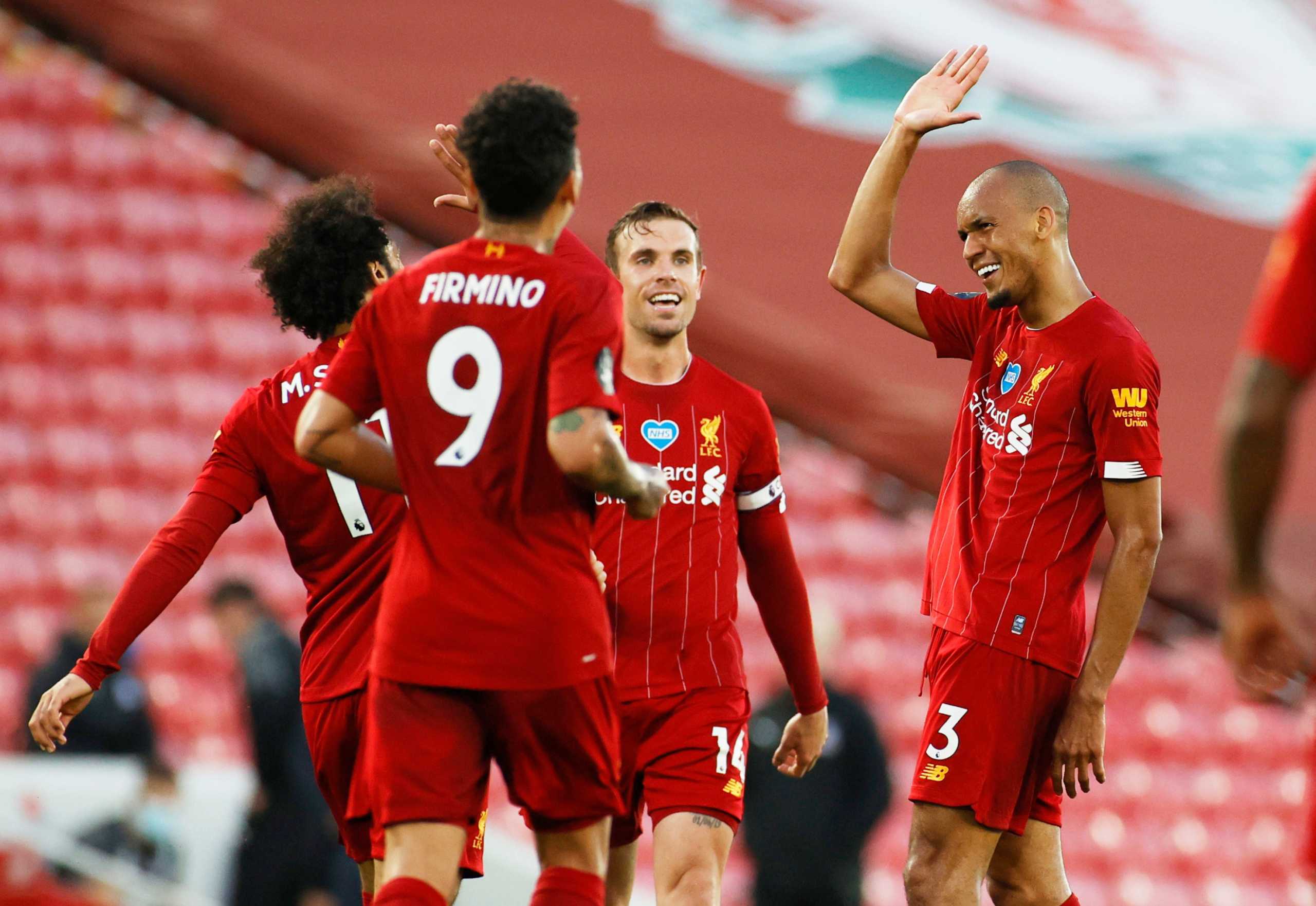 Soccer Football - Premier League - Liverpool v Crystal Palace - Anfield, Liverpool, Britain - June 24, 2020  Liverpool's Fabinho celebrates scoring their third goal with teammates, as play resumes behind closed doors following the outbreak of the coronavirus disease (COVID-19) REUTERS