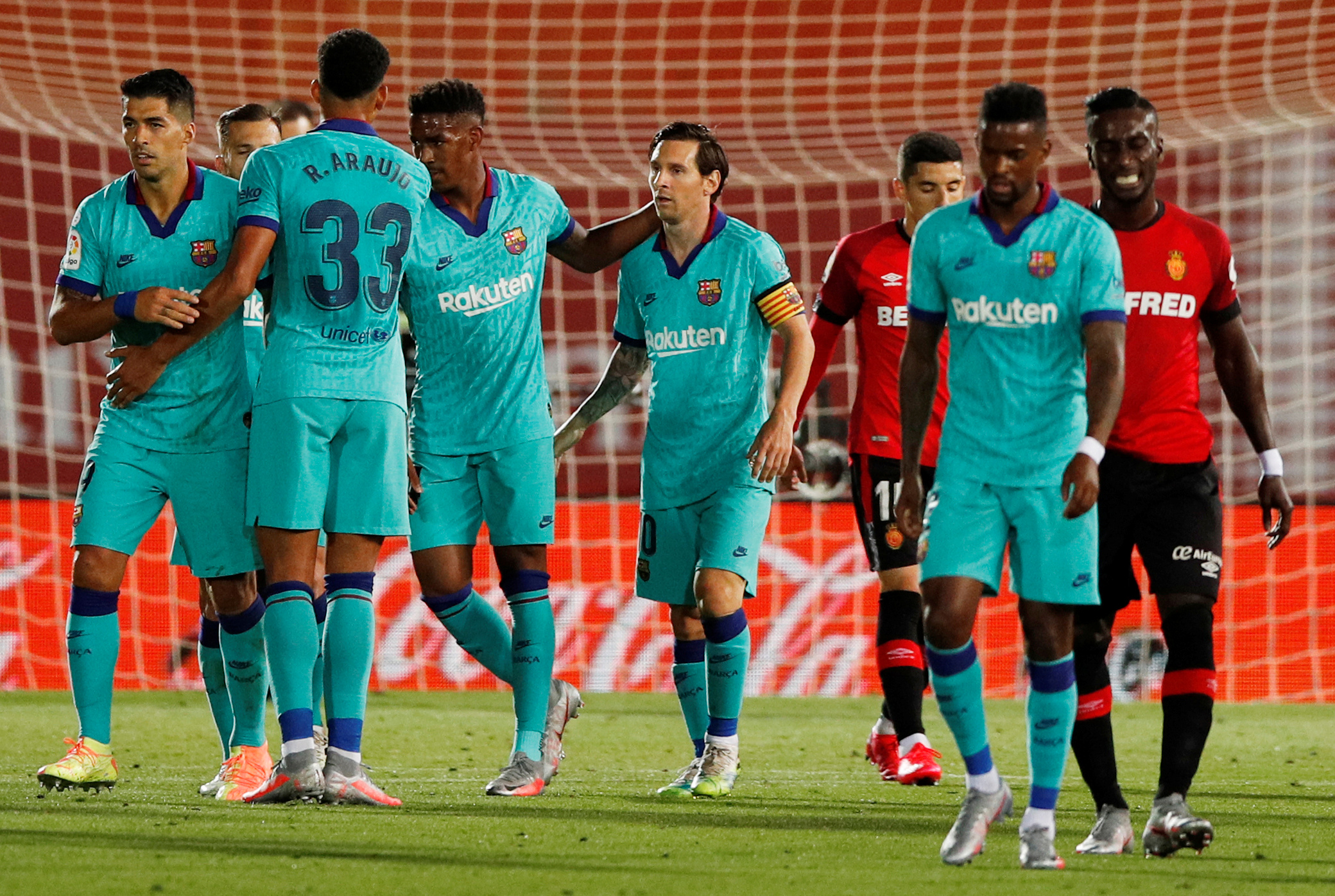 Soccer Football - La Liga Santander - RCD Mallorca v FC Barcelona - Iberostar Stadium, Palma, Spain - June 13, 2020   Barcelona's Lionel Messi celebrates scoring their fourth goal with teammates, as play resumes behind closed doors following the outbreak of the coronavirus disease (COVID-19)   REUTERS