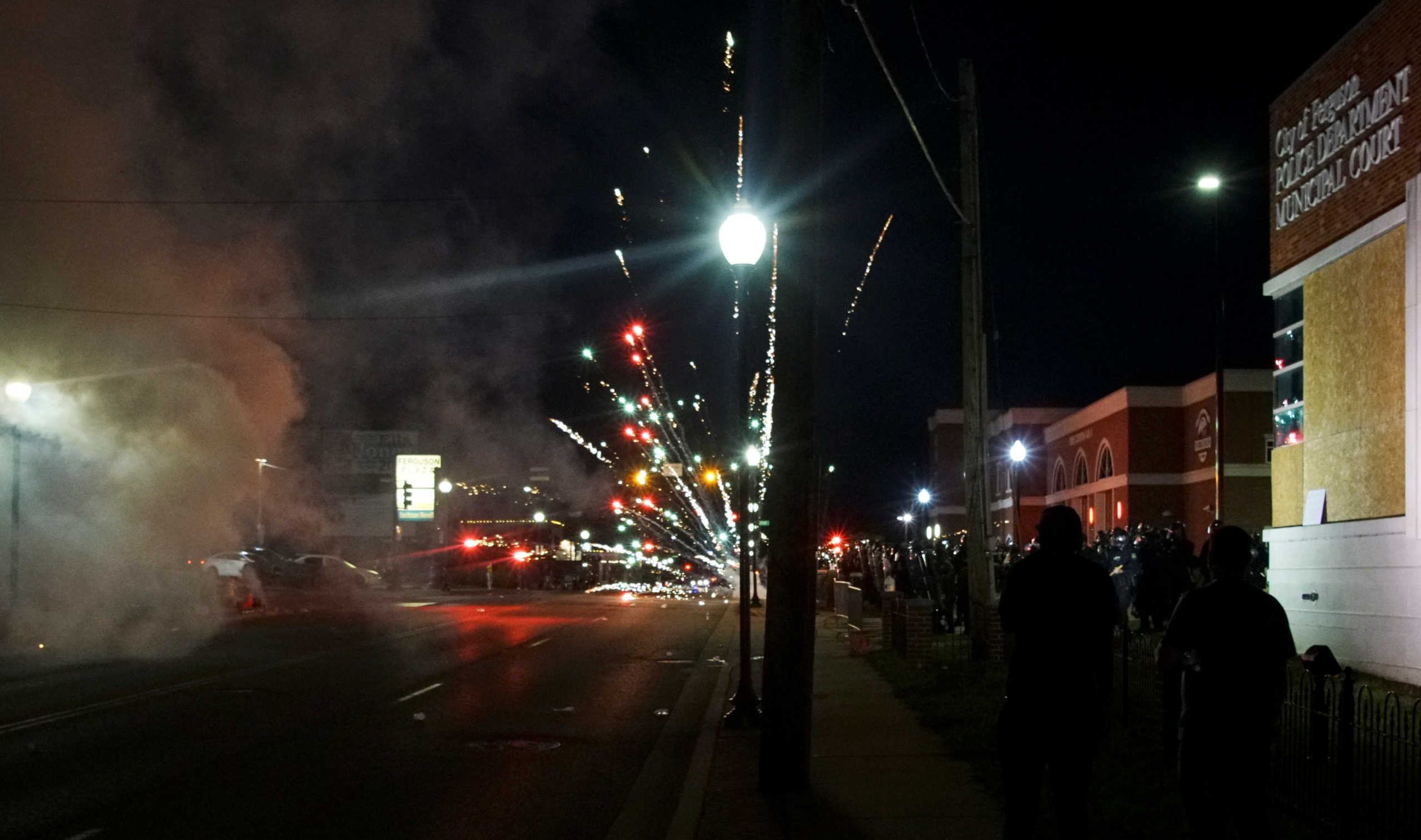 Fireworks explode in front of police during a protest against the death in Minneapolis police custody of African-American man George Floyd, in Ferguson, Missouri, U.S. May 31, 2020. REUTERS
