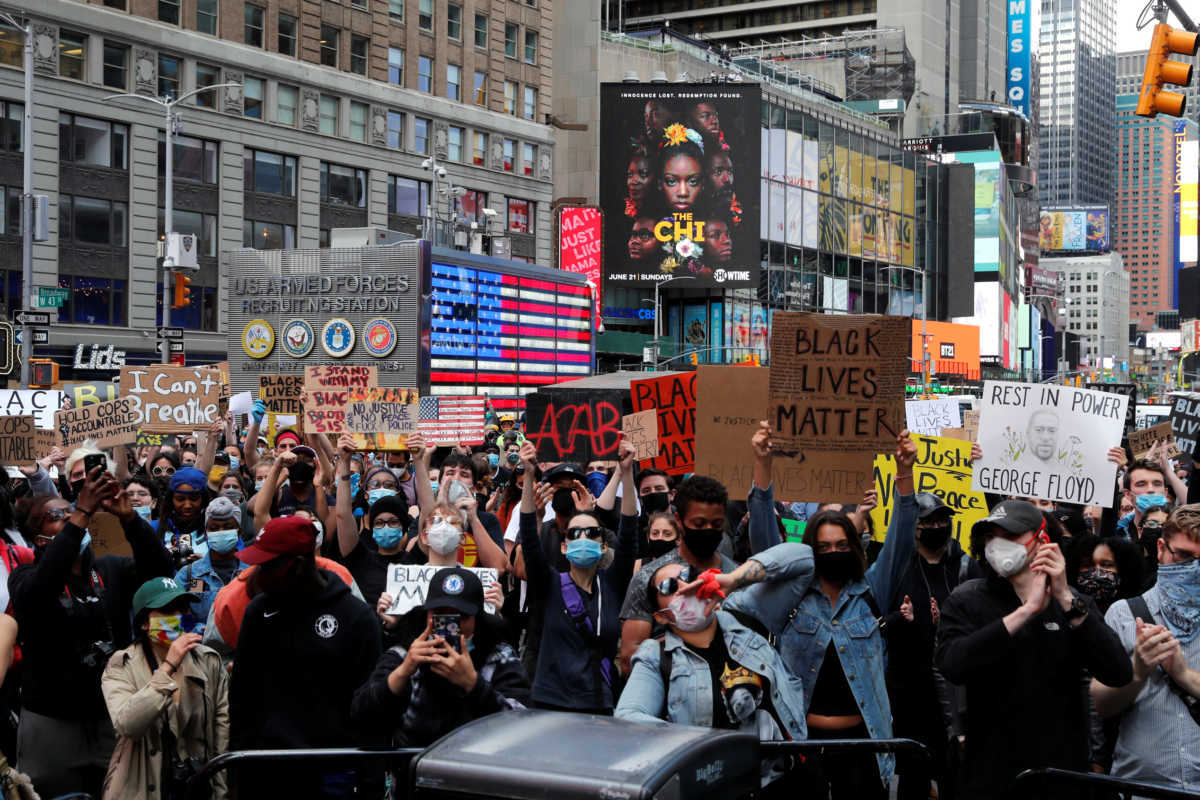 Protesters rally against the death in Minneapolis police custody of George Floyd, in Times Square in the Manhattan borough of New York City, U.S., June 1, 2020. REUTERS