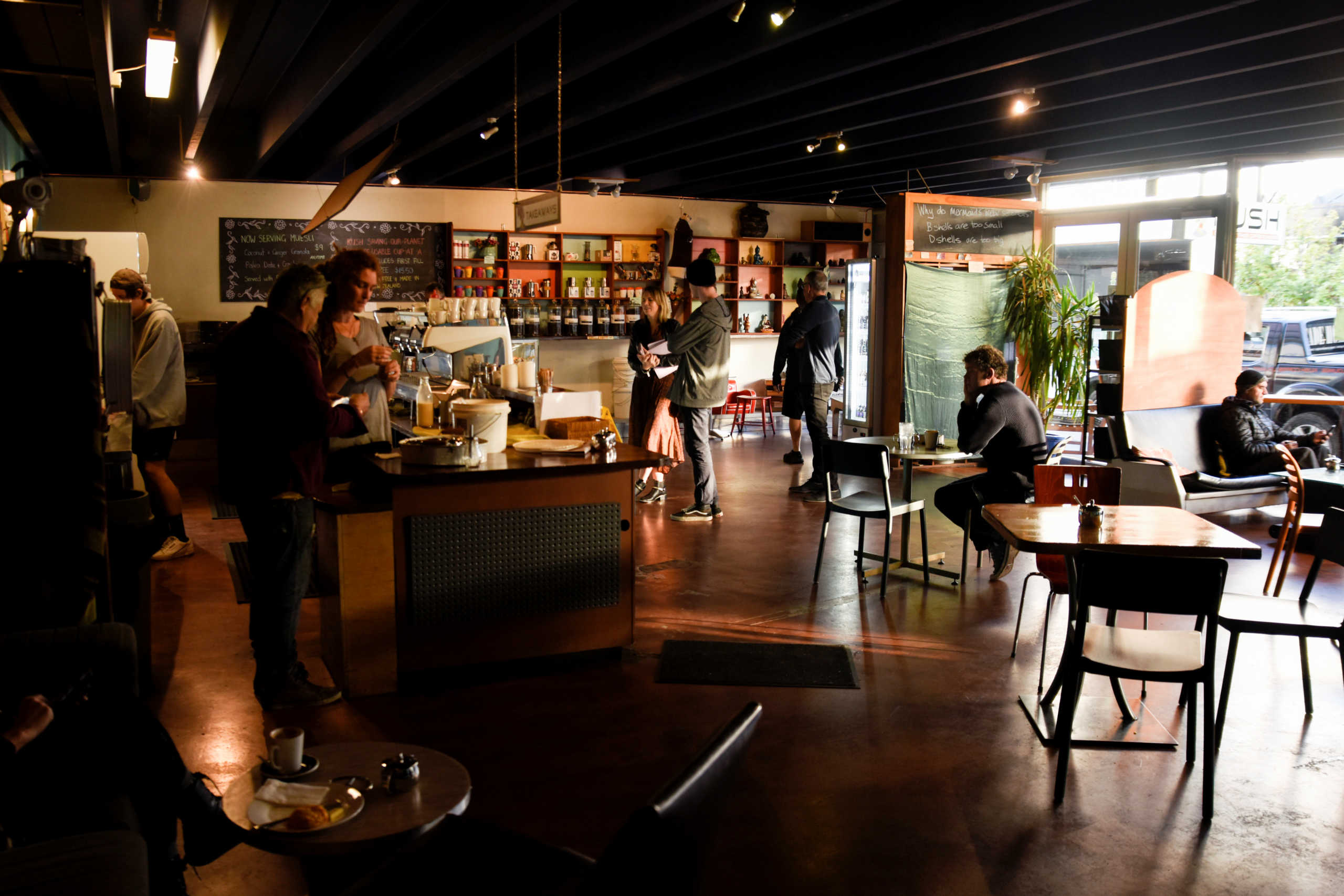 Customers and employees are seen inside a cafe on the first day of all New Zealand domestic regulations being lifted for the coronavirus disease (COVID-19) in Nelson, New Zealand, June 9, 2020.  REUTERS