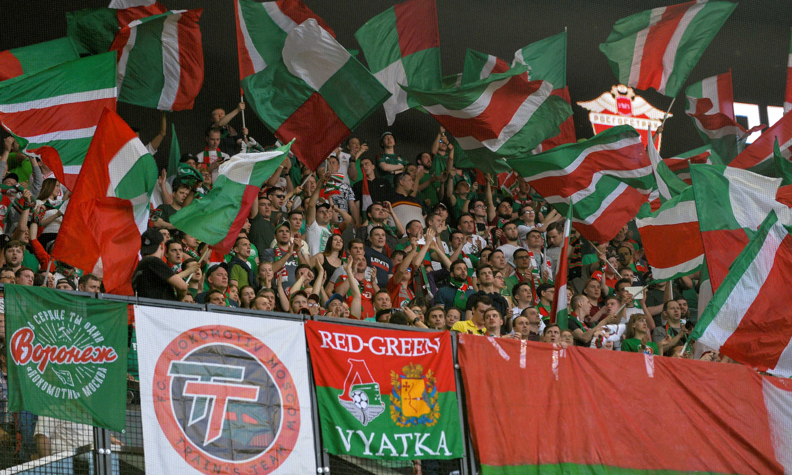 FILE PHOTO: Football Soccer - Russian Premier League - FC Krasnodar v Lokomotiv Moscow - Krasnodar Stadium, Krasnodar, Russia - April 30, 2018  Lokomotiv Moscow fans cheer their team. REUTERS