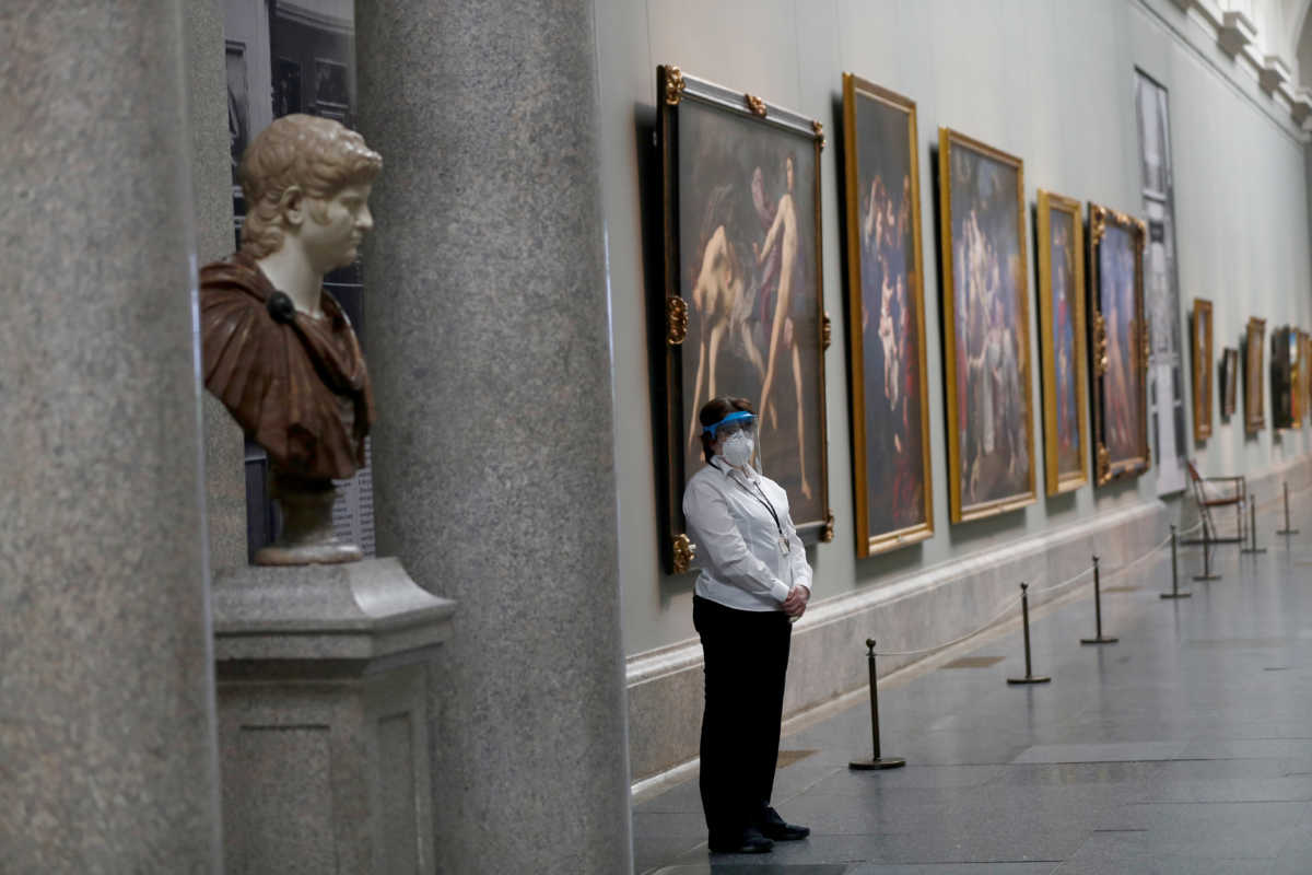 FILE PHOTO: FILE PHOTO: A museum worker wears a protective mask as the Prado museum prepares for reopening on June 6th amid the coronavirus disease (COVID-19) outbreak, in Madrid, Spain, June 4, 2020. REUTERS
