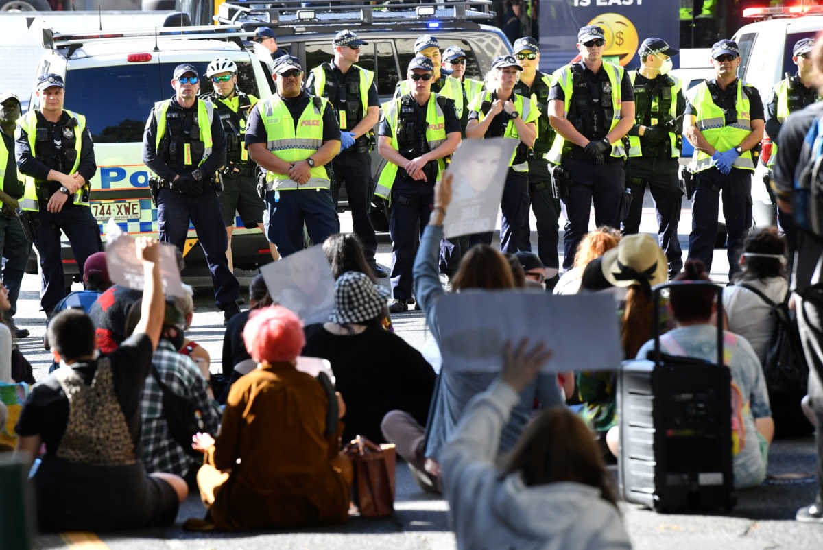 Police and protesters are seen during a Black Lives Matter demonstration, in the wake of global protests against police brutality and the death in Minneapolis police custody of George Floyd, in Brisbane, Australia, June 17, 2020. Picture taken June 17, 2020.  AAP Image