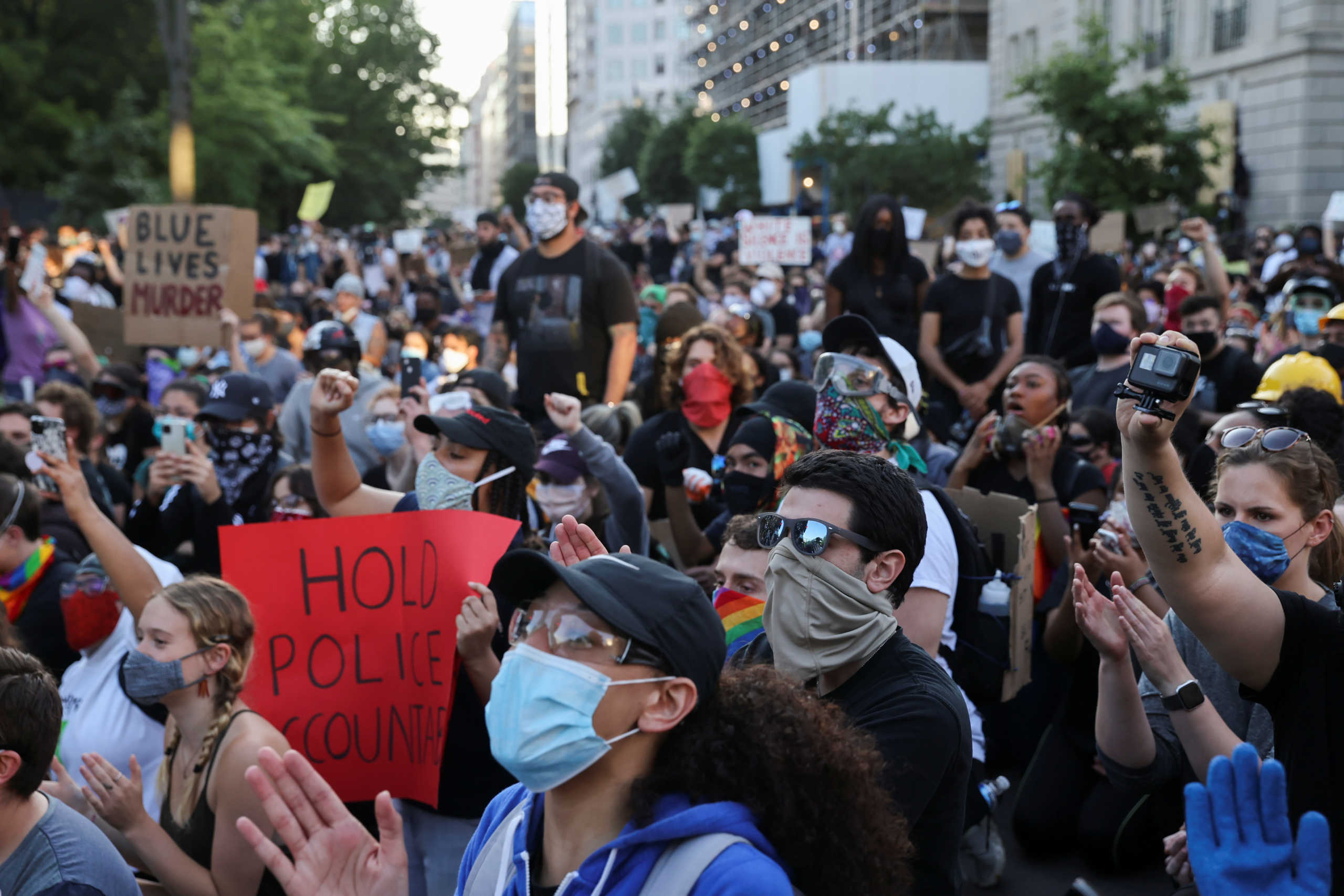 Demonstrators take a knee in front of the fence surrounding Lafayette Park outside the White House as protests continue over the death in police custody of George Floyd, in Washington, U.S., June 2, 2020. REUTERS