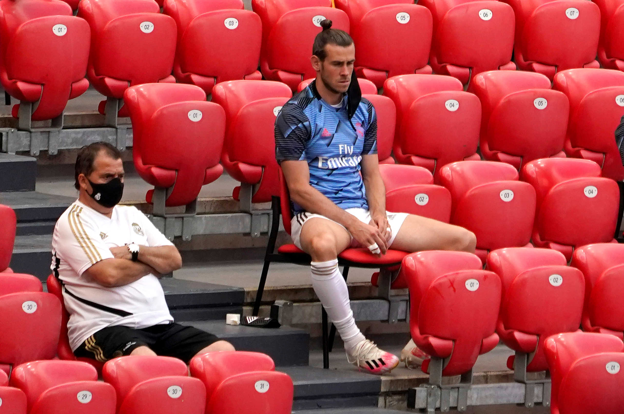 Soccer Football - La Liga Santander - Athletic Bilbao v Real Madrid - San Mames, Bilbao, Spain - July 5, 2020  Real Madrid substitute Gareth Bale sits in the stands, as play resumes behind closed doors following the outbreak of the coronavirus disease (COVID-19)   REUTERS