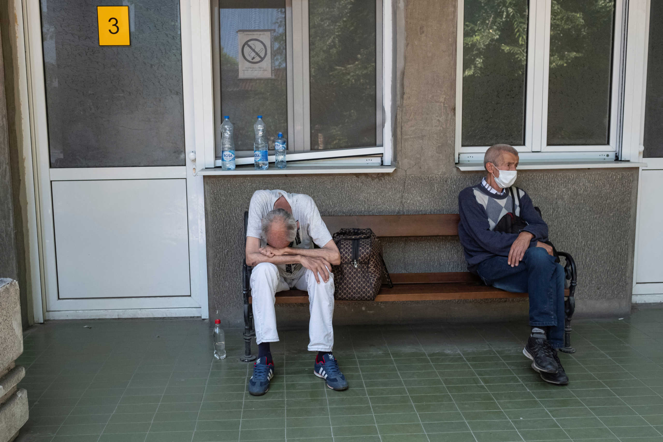 People suspected to be infected with coronavirus disease (COVID-19) wait in front of the Hospital for Infectious and Tropical Diseases of the Clinical Center of Serbia in Belgrade, Serbia June 26, 2020. REUTERS