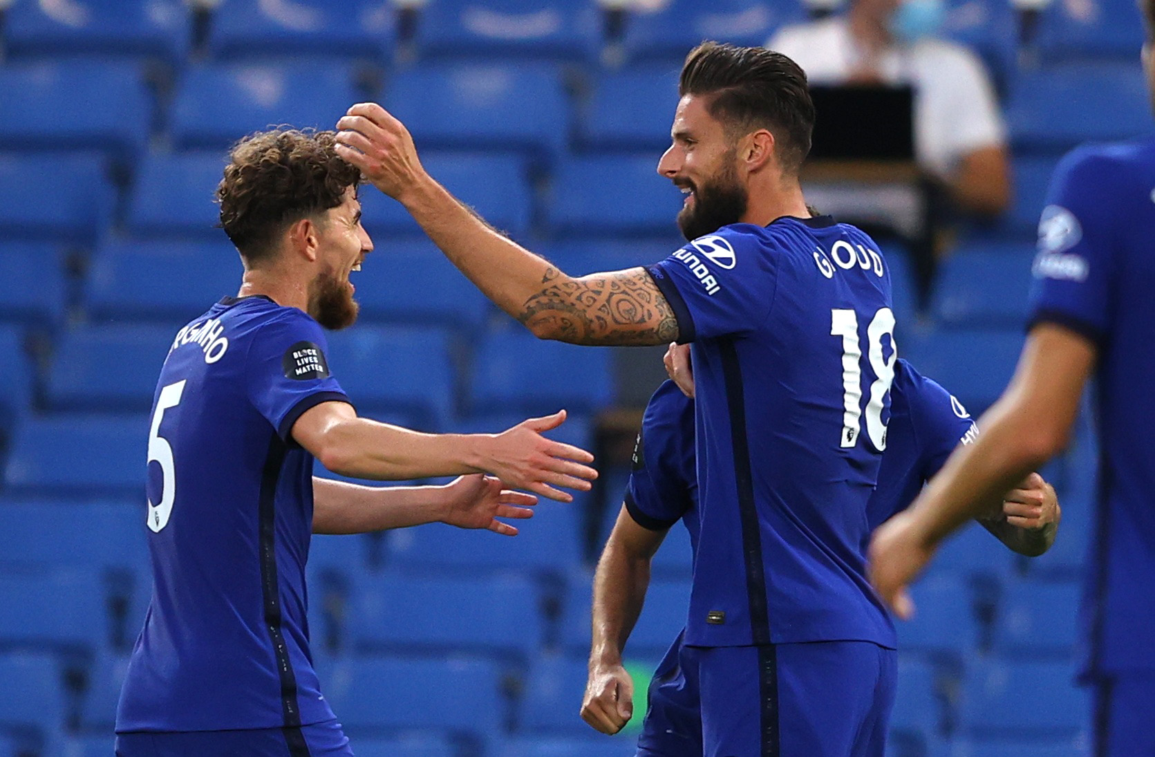 Soccer Football - Premier League - Chelsea v Norwich City - Stamford Bridge, London, Britain - July 14, 2020 Chelsea's Olivier Giroud celebrates scoring their first goal with teammates, as play resumes behind closed doors following the outbreak of the coronavirus disease (COVID-19) Pool via REUTERS