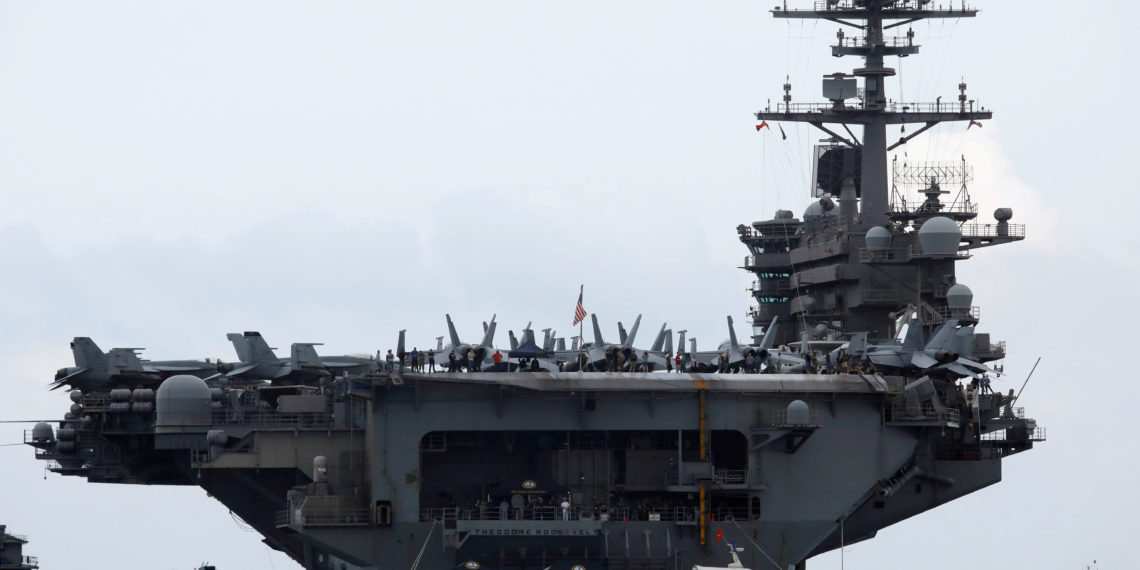 FILE PHOTO: The USS Theodore Roosevelt (CVN-71) is seen while entering into the port in Da Nang, Vietnam, March 5, 2020. REUTERS