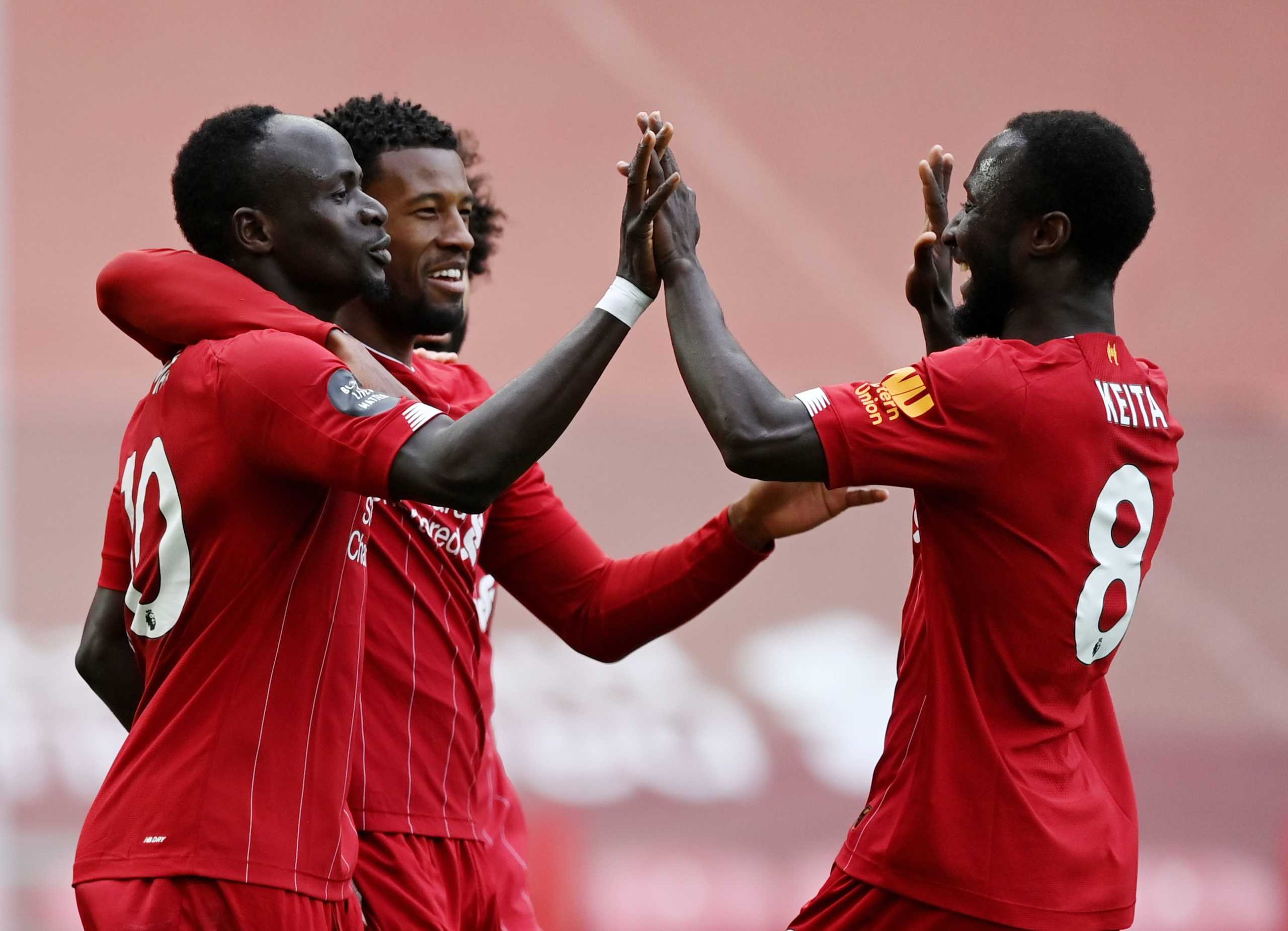 Soccer Football - Premier League - Liverpool v Aston Villa - Anfield, Liverpool, Britain - July 5, 2020  Liverpool's Sadio Mane celebrates scoring their first goal with Naby Keita and Georginio Wijnaldum, as play resumes behind closed doors following the outbreak of the coronavirus disease (COVID-19) Shaun Botterill