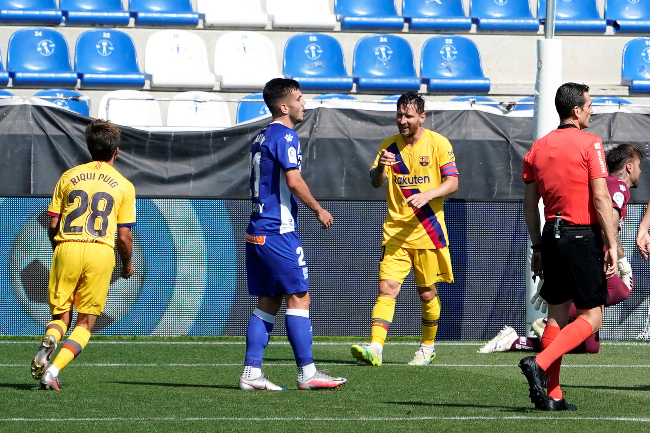 Soccer Football - La Liga Santander - Deportivo Alaves v FC Barcelona - Estadio Mendizorroza, Vitoria-Gasteiz, Spain - July 19, 2020  Barcelona's Lionel Messi celebrates scoring their second goal as Deportivo Alaves' Martin Aguirregabiria looks dejected, as play resumes behind closed doors following the outbreak of the coronavirus disease (COVID-19)  REUTERS