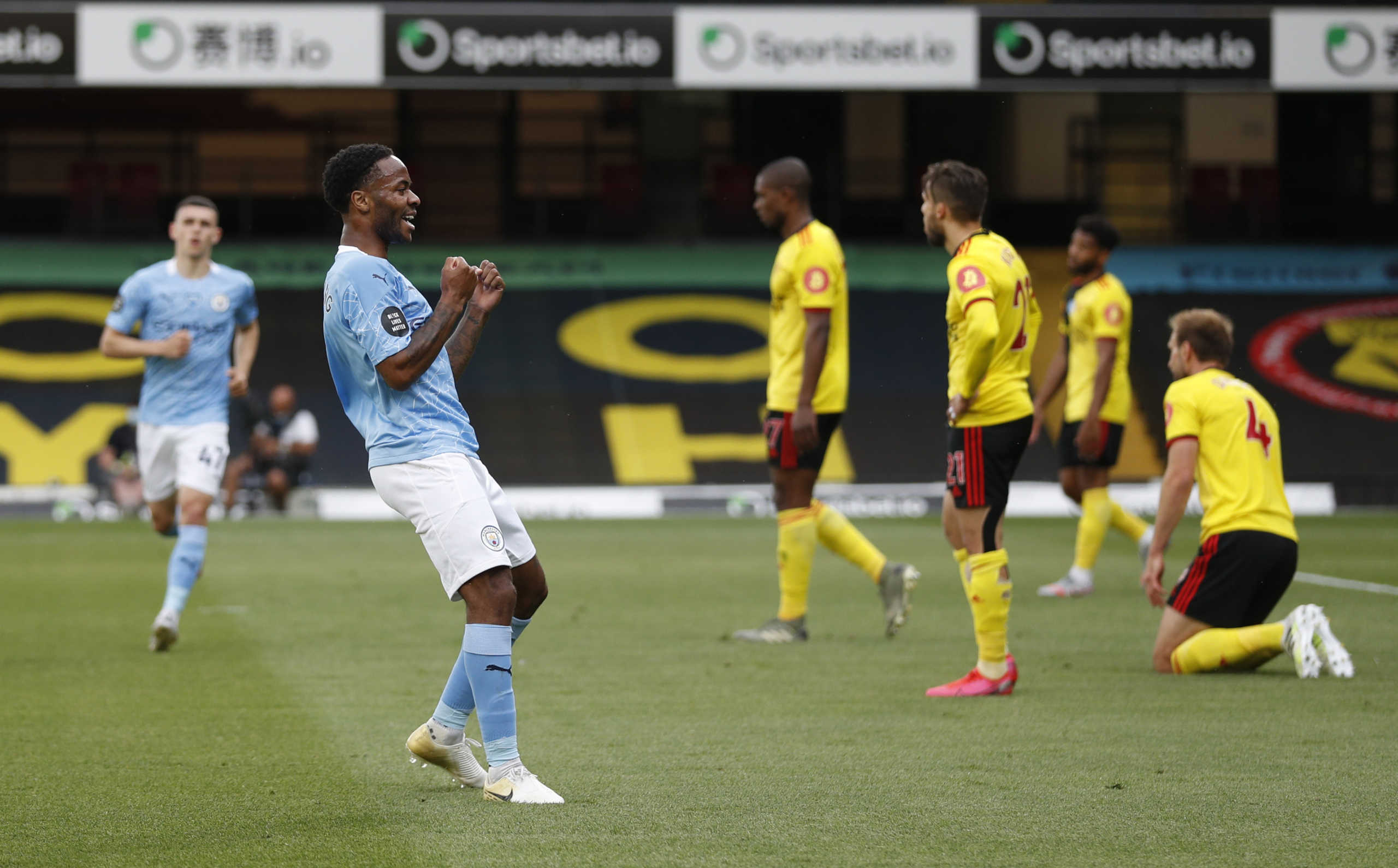 Soccer Football - Premier League - Watford v Manchester City - Vicarage Road, Watford, Britain - July 21, 2020 Manchester City's Raheem Sterling celebrates scoring their first goal, as play resumes behind closed doors following the outbreak of the coronavirus disease (COVID-19) Pool via REUTERS