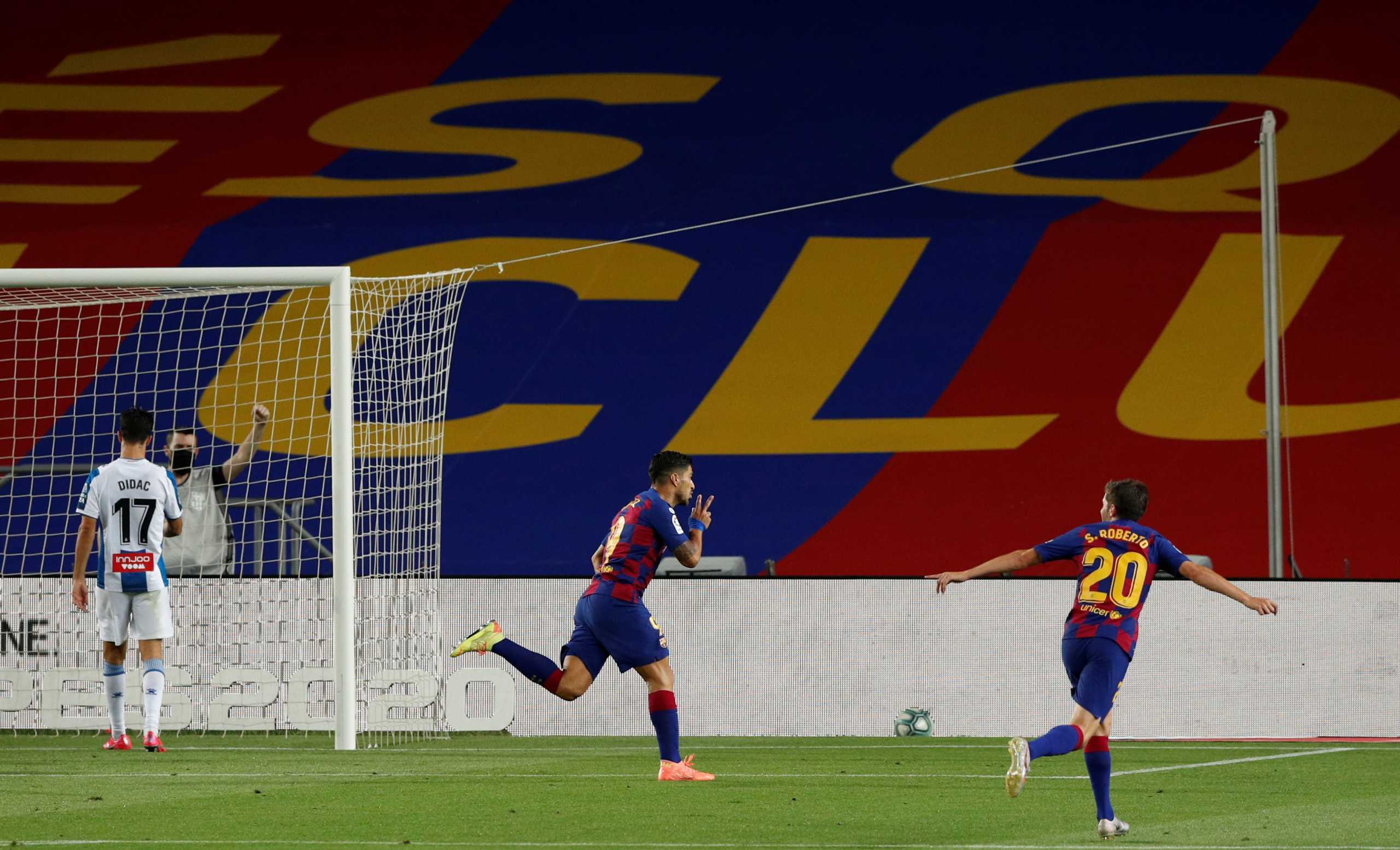 Soccer Football - La Liga Santander - FC Barcelona v Espanyol - Camp Nou, Barcelona, Spain - July 8, 2020   Barcelona's Luis Suarez celebrates scoring their first goal, as play resumes behind closed doors following the outbreak of the coronavirus disease (COVID-19)   REUTERS