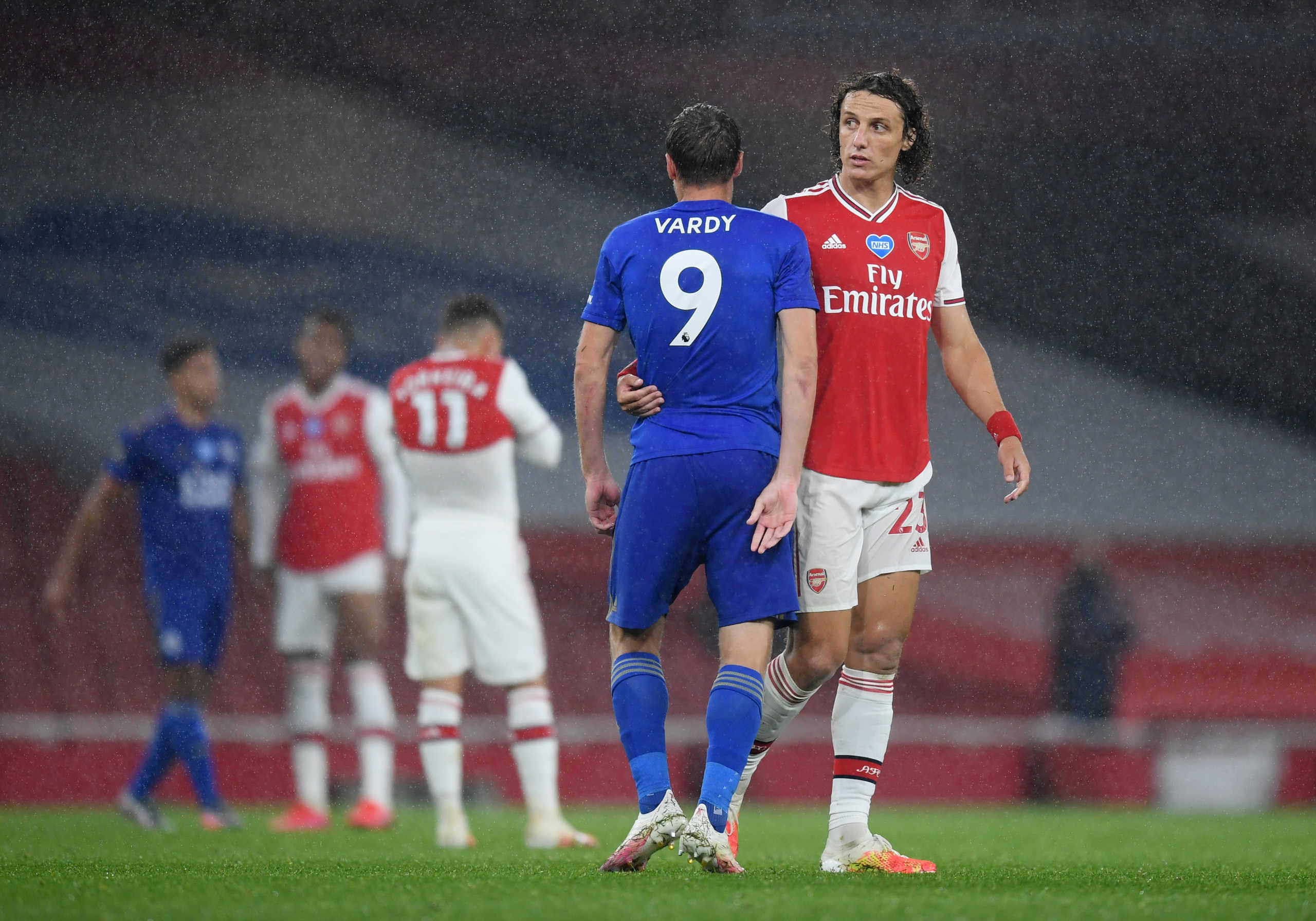 Soccer Football - Premier League - Arsenal v Leicester City - Emirates Stadium, London, Britain - July 7, 2020  Arsenal's David Luiz and Leicester City's Jamie Vardy after the match, as play resumes behind closed doors following the outbreak of the coronavirus disease (COVID-19)  Michael Regan